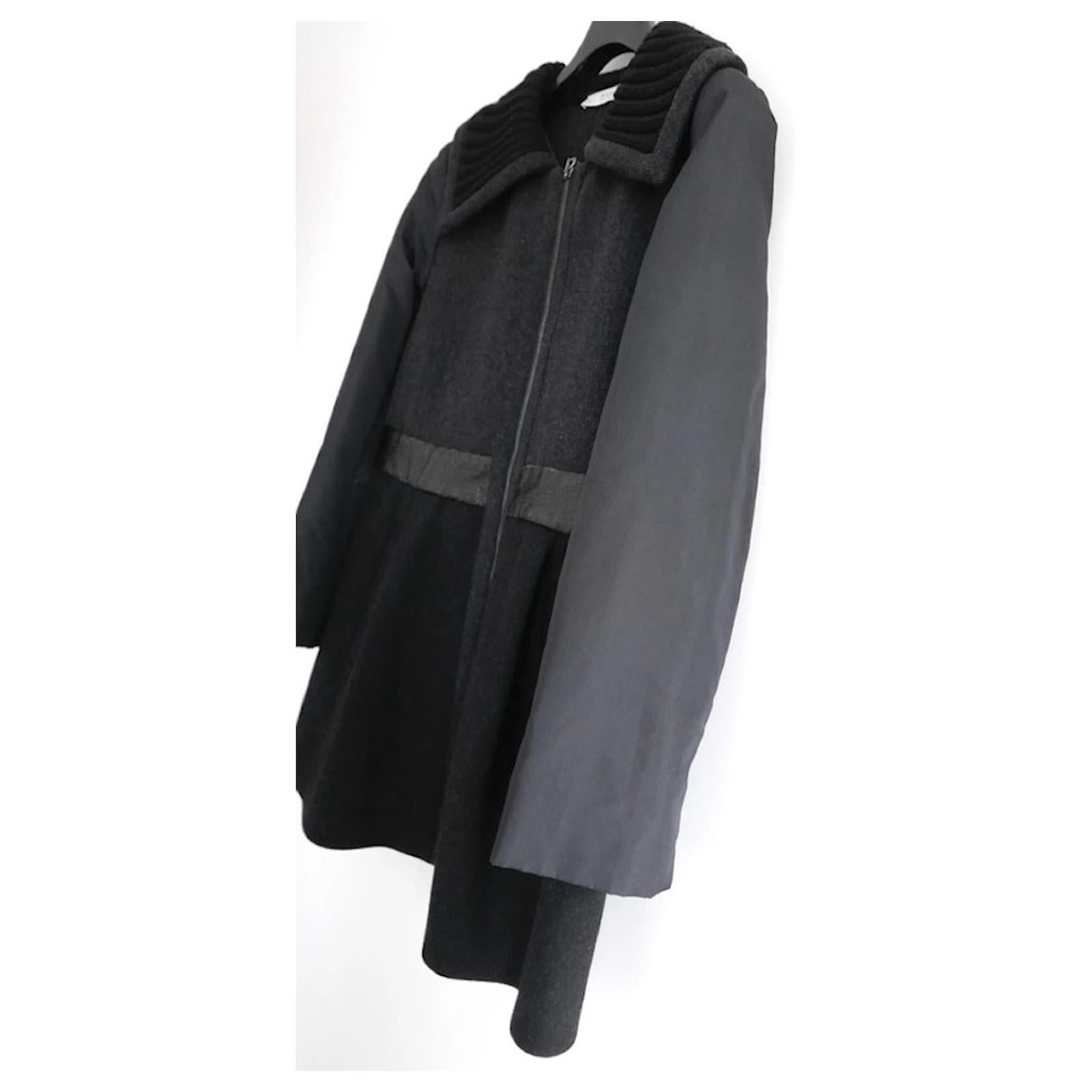 Fabulous archival Prada coat from the Fall 2006 collection. made from soft, thick grey and black wool with black nylon sleeves, knitted collar and crackled patent leather waistband. It has a very flattering fit and flare cut with welt front pockets