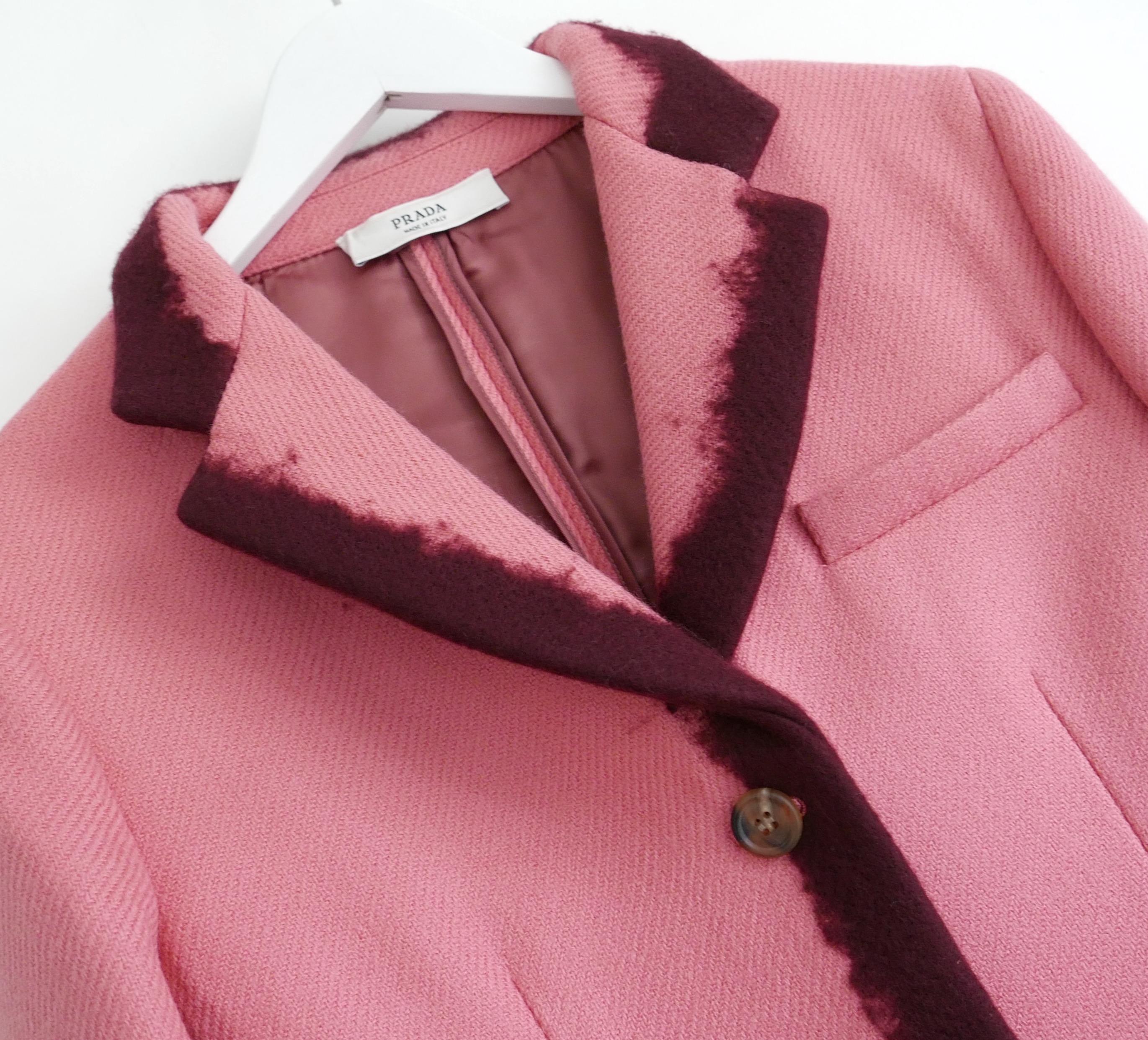 Utterly amazing Prada Fall 2007 jacket in super rare, worn once condition. Made from bubblegum pink wool twill with burgundy hand applied felted ombre edgings. Superbly tailored with pannier padded shaped hips, flap pockets, slit cuffs with poppers,