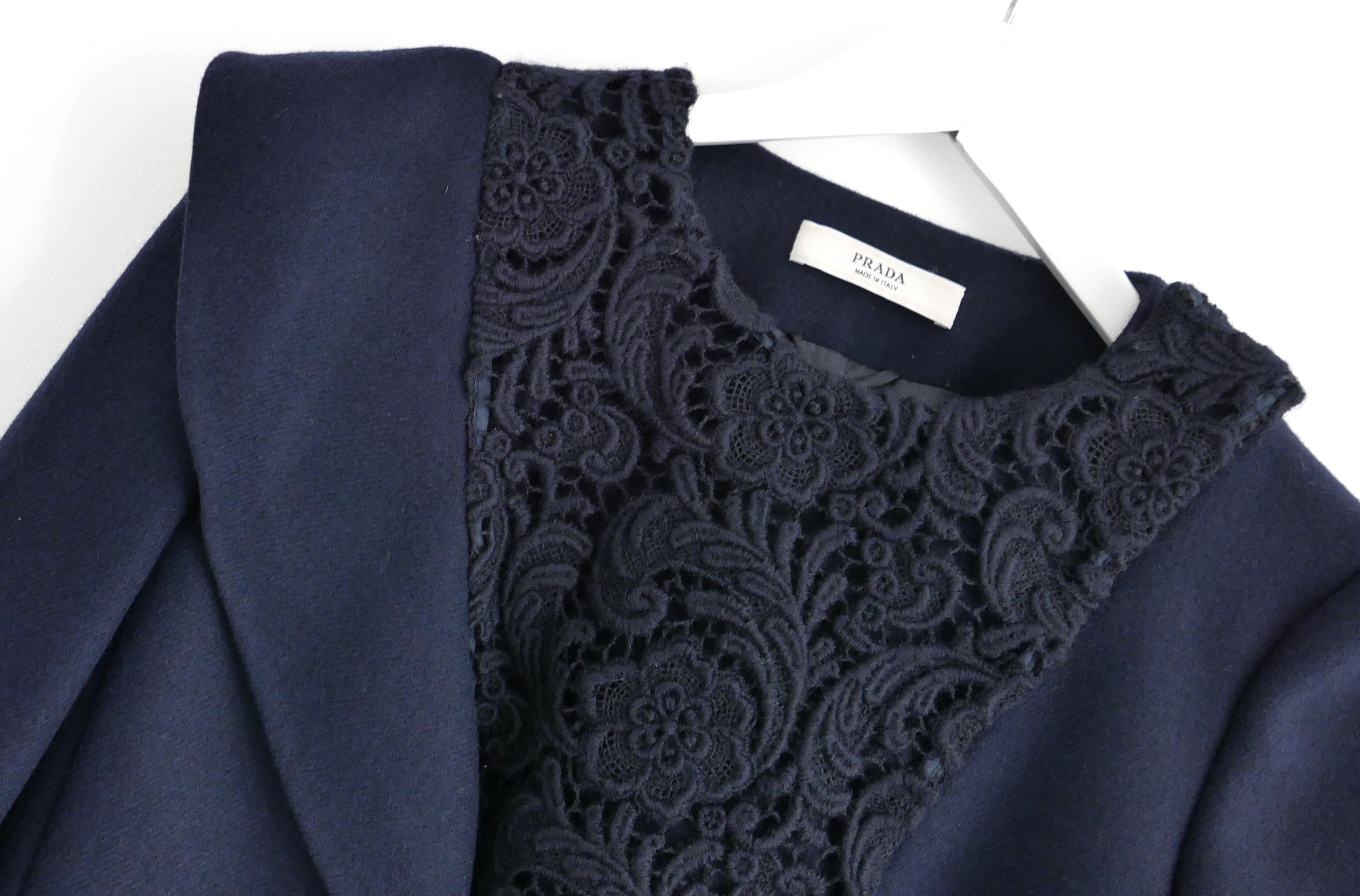 Beautiful archival Prada lace trim jacket from the Fall 2008 collection - look 8 on the runway. Made from thick midnight navy wool with a beautiful handcrafted wool mix lace yoke to front. It has a tailored, cropped cut with asymmetric ruffle