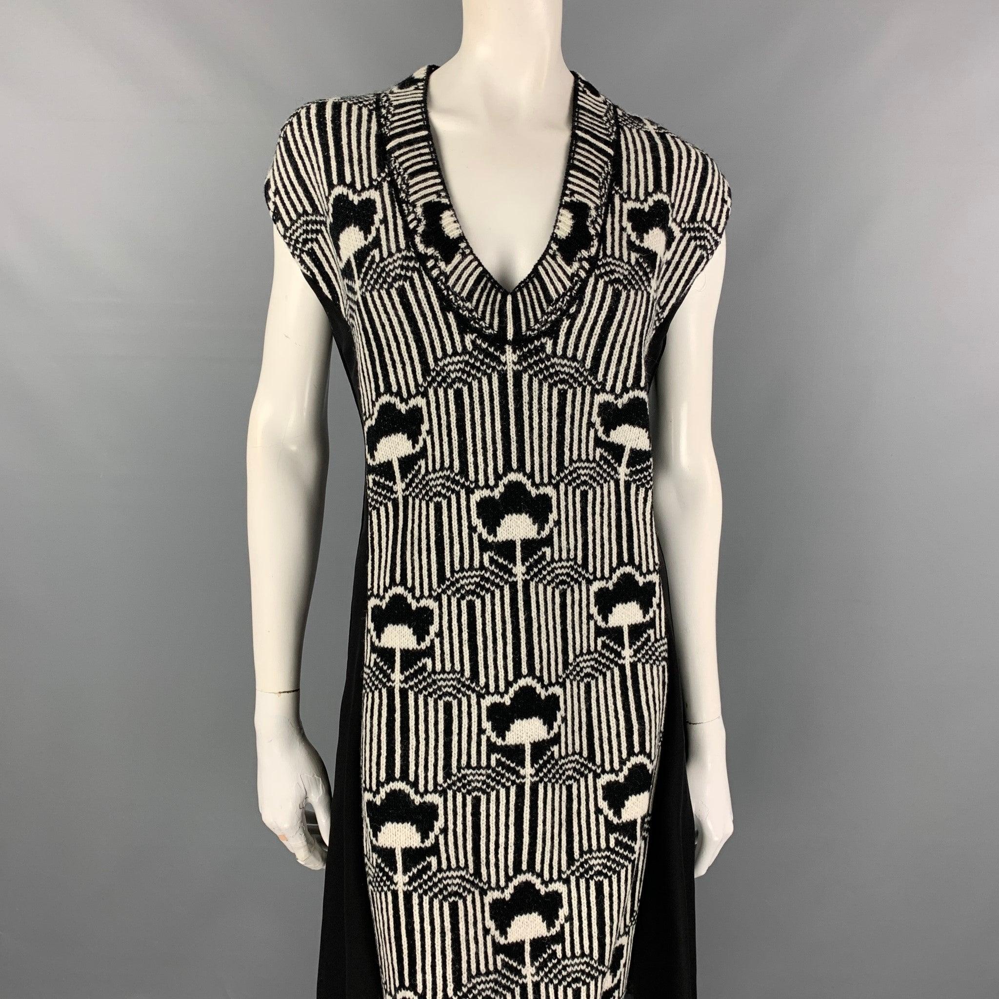 PRADA Fall '21 dress comes in a black & white floral crepe jacquard knit wool / silk featuring pleated chiffon panel sides, slip on, sleeveless, and a v-neck. Made in Italy.
Brand New.
 

Marked:   38 

Measurements: 
 
Shoulder: 17 inches Bust: 38
