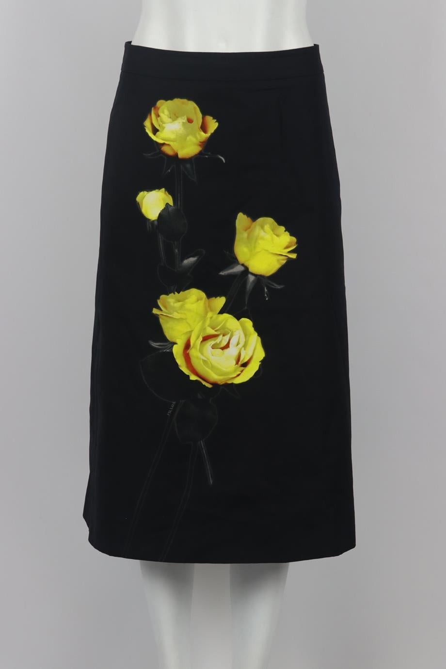 Prada floral print cotton midi skirt. Black. Zip fastening at side. 100% Cotton; lining: 100% viscose. Size: IT 42 (UK 10, US 6, FR 38). Waist: 30 in. Hips: 40.5 in. Length: 29 in. Very good condition - No sign of wear; see pictures.