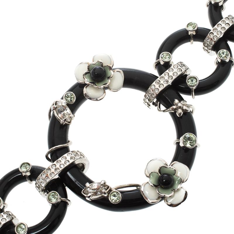 Taking inspiration from the mystery of geishas and Japanese florals, Prada brings forth this enchanting creation that looks absolutely breathtaking! The Flower Power black plexiglas bracelet features circular rings that are linked together and