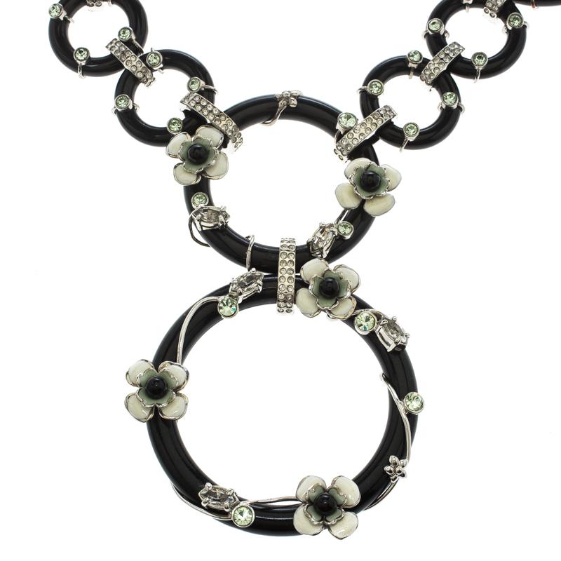 Taking inspiration from the mystery of geishas and Japanese florals, Prada brings forth this enchanting necklace that looks absolutely breathtaking! The Flower Power black plexiglas necklace features circular rings that are linked together and