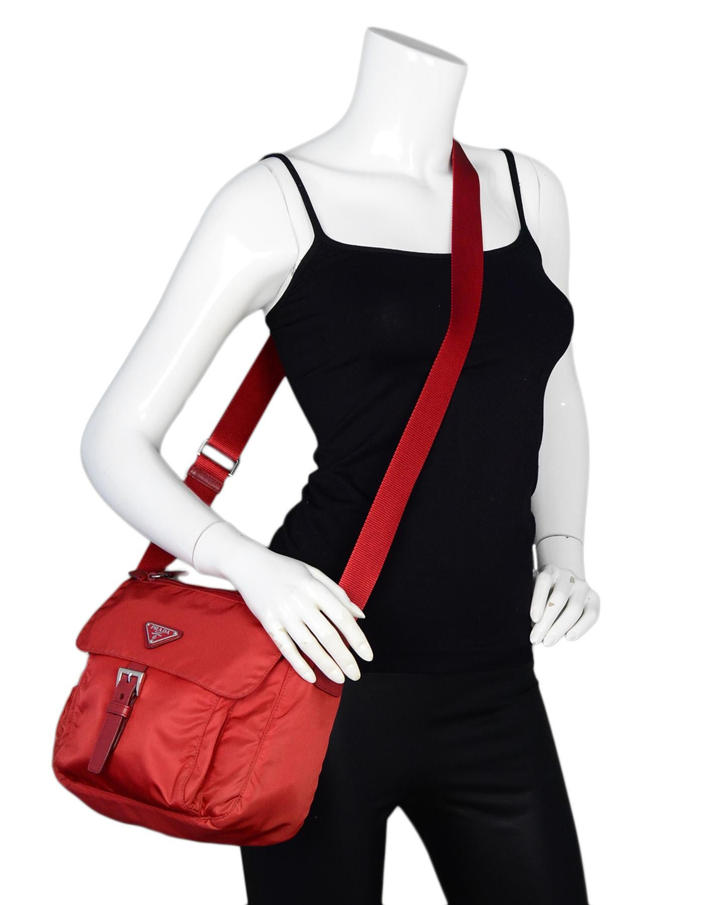 Prada Fouco Red Nylon Flap Buckle Messenger Bag BT8994

Made In: Italy
Color: Red
Hardware: Silvertone hardware
Materials: Nylon, leather trim
Lining: Red monogram textile
Closure/Opening: Flap with buckle closure
Exterior Pockets: One slit pocket