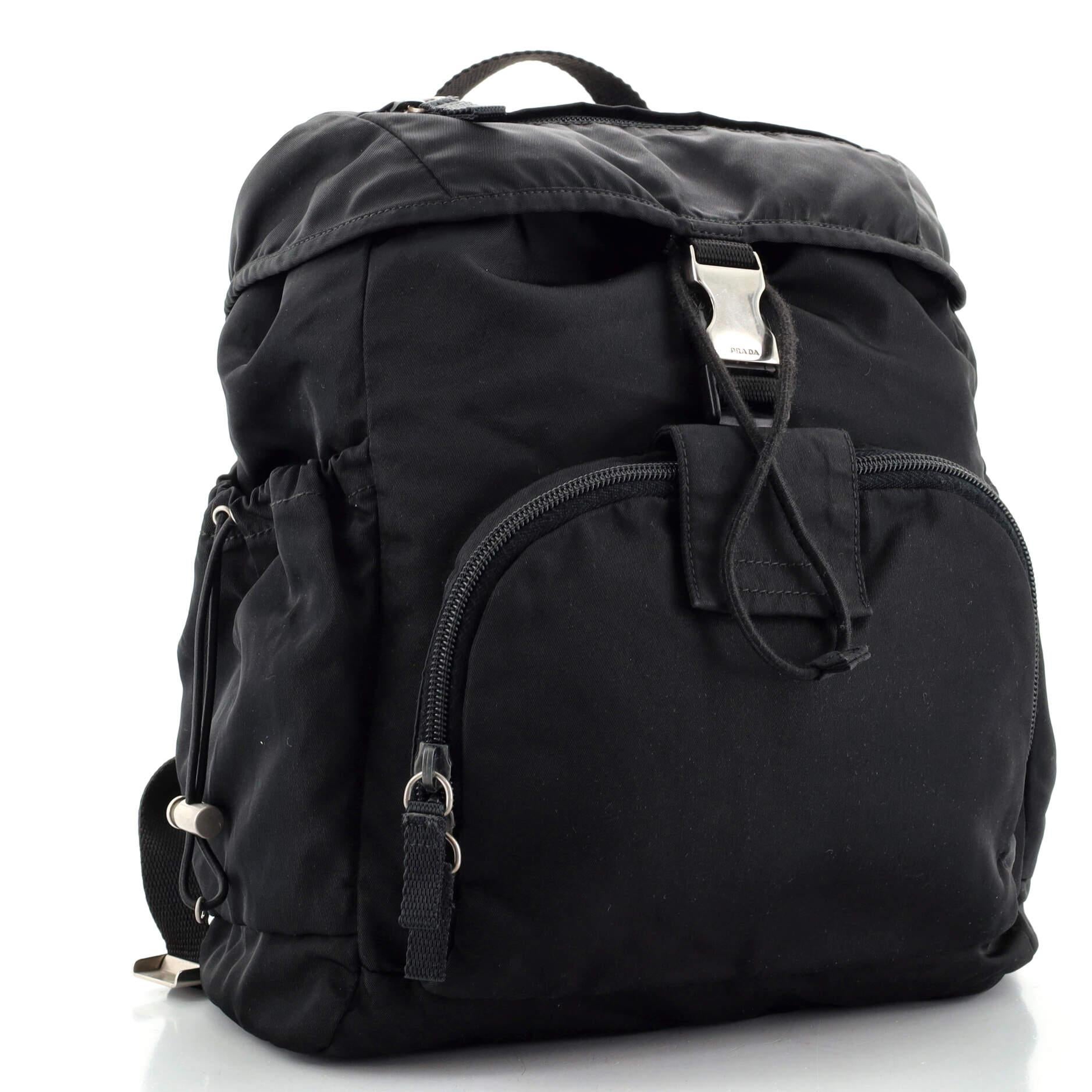 Condition: Fair. Creasing, wear and marks on exterior and in interior, heavy wear and fraying on straps and handle, stains on straps. Discoloration in flap pocket, scratches and tarnish on hardware.
Accessories: No Accessories
Measurements: Handle