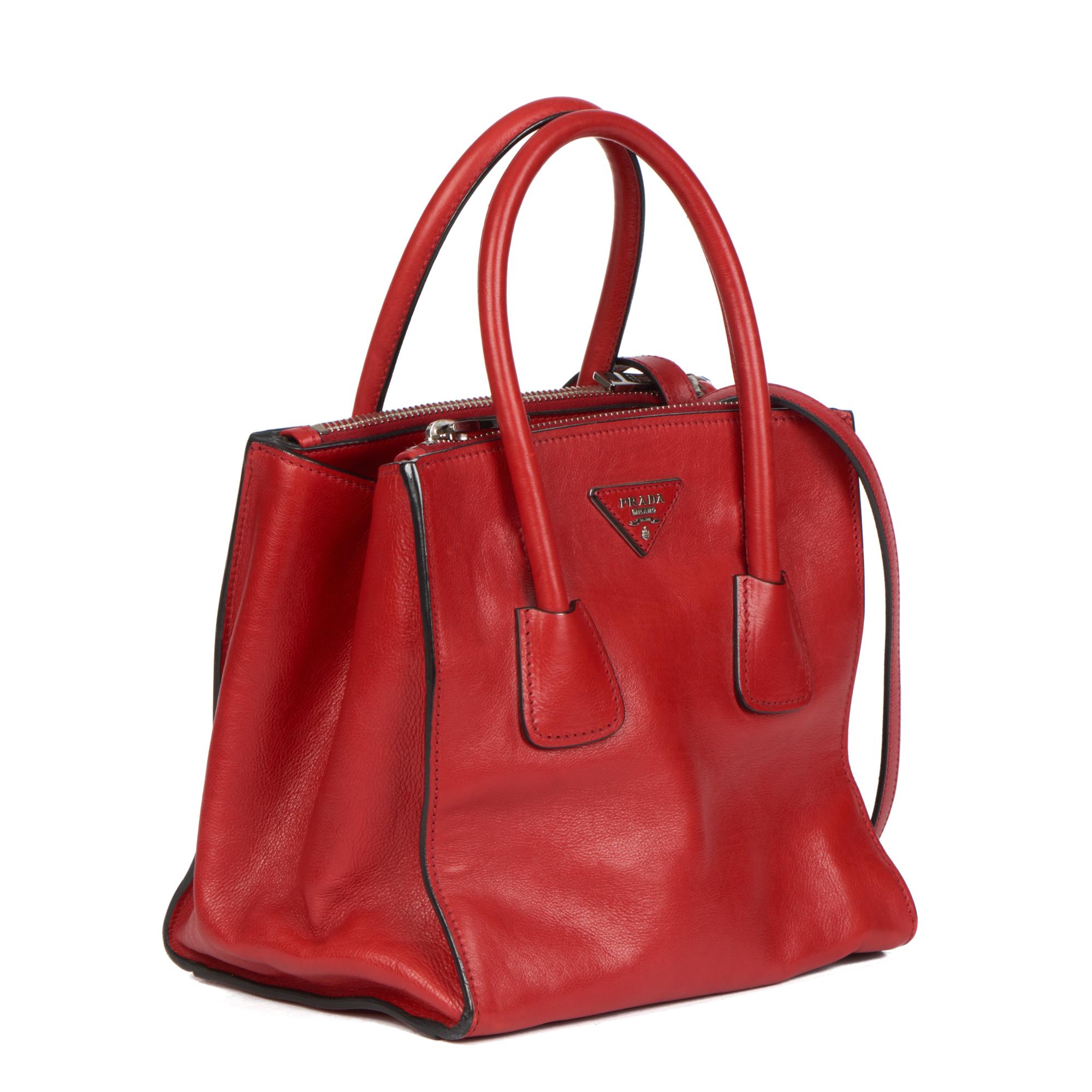 Prada FUOCO GLACE CALFSKIN LEATHER TWIN POCKET DOUBLE HANDLE TOTE

CONDITION NOTES
The exterior is in excellent condition with light signs of use.
The interior is in excellent condition with minimal signs of use.
The hardware is in excellent