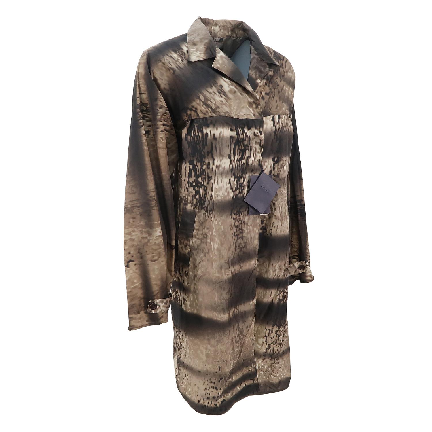 Approaching the cliché idea of army print jackets in exciting and innovative ways is a Prada leitmotif, creating exclusive prints that enhance the most classic shapes. The nylon trench coat is a Prada signature, but the Italian designer adds