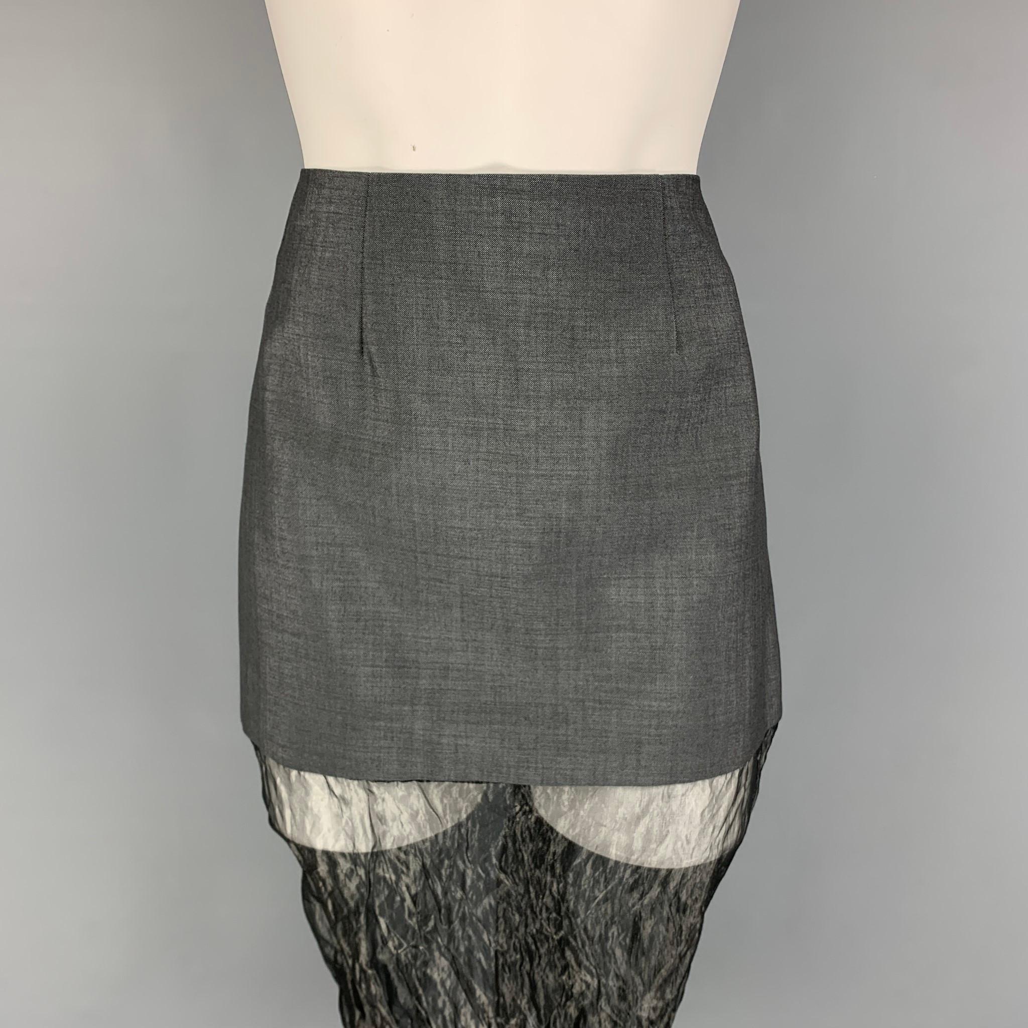 PRADA FW 22 skirt comes in a grey mohair blend featuring a mini style with a crinkled muslin insert, back slit, and a side zipper closure. Made in Italy.

Excellent Pre-Owned Condition.
Marked: 38
Original Retail Price:
