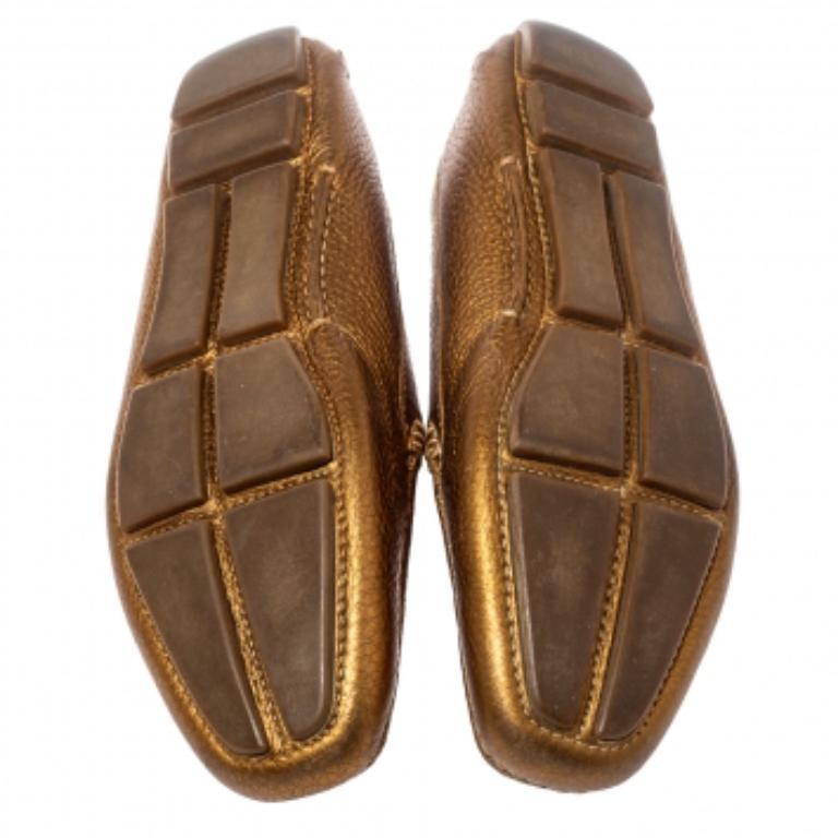 If you are on the lookout for a pair of snug and trendy shoes, this Prada creation is the answer. Crafted from gold leather and designed into a lovely shape, this pair of loafers brings a blend of luxury and comfort. They feature logos on the