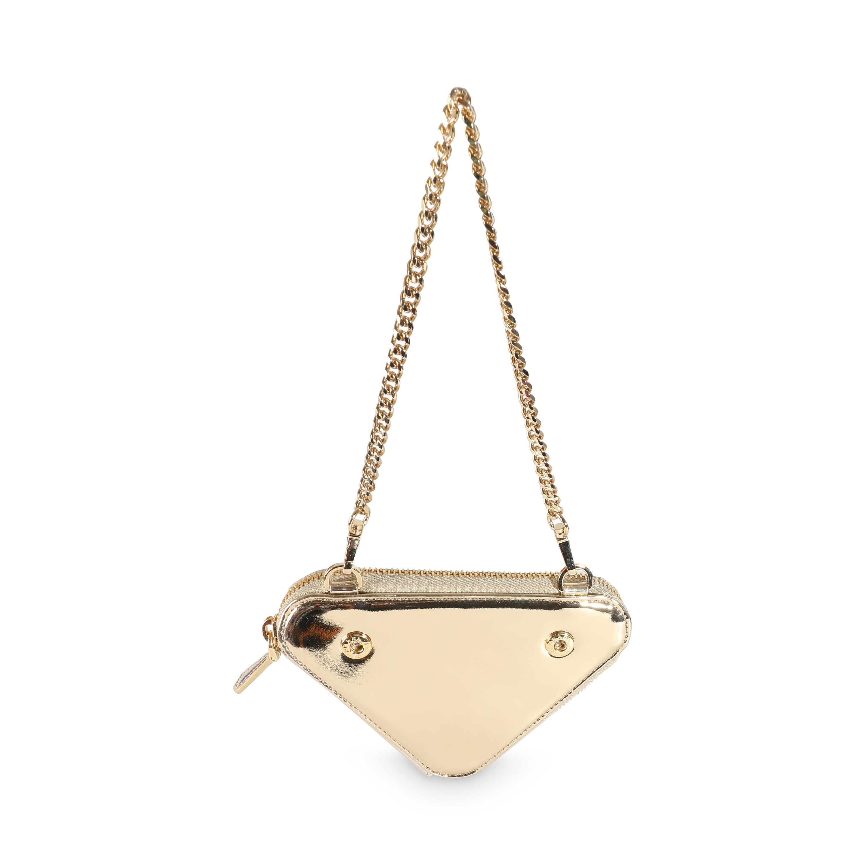 Listing Title: Prada Gold Satin Crystal Embellished Mini Triangular Pouch
SKU: 139987
MSRP: 2100.00 USD
Condition: Pre-owned 
Handbag Condition: Excellent
Condition Comments: Item is in excellent condition and displays light signs of wear.  Minor