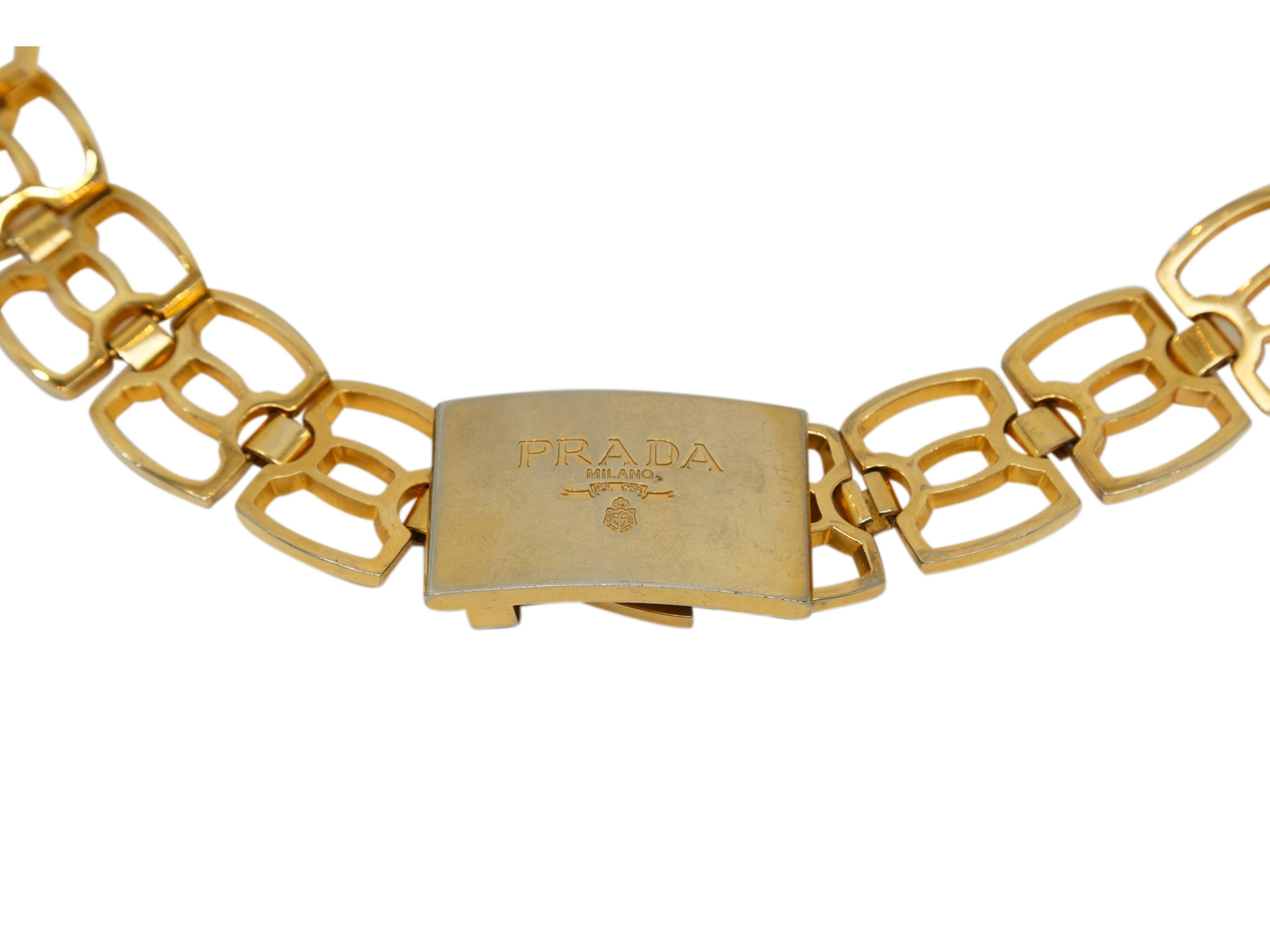 Product details: Vintage gold-tone chain belt by Prada. Brand logo at front hook closure. 35