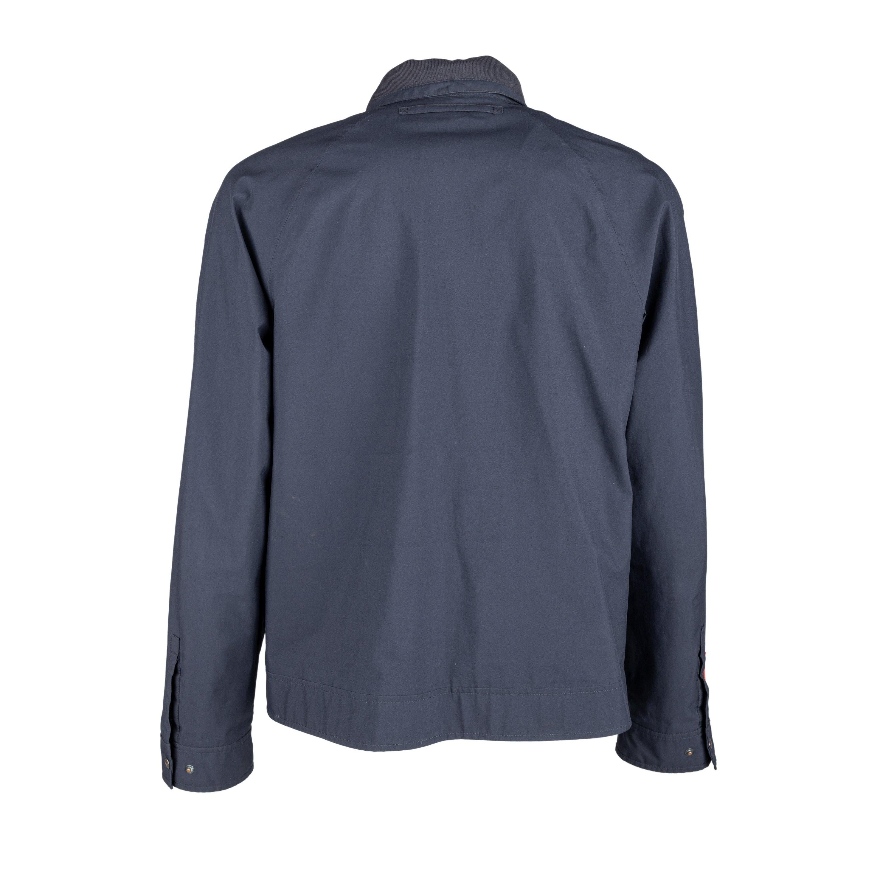 Designed for durability and style, the Prada Goretex® Windbreaker Jacket is crafted from high-quality polyester with Goretex technology. Its dark blue color and hidden zipper closure offer a sleek look, while the brand accent on the hardware and