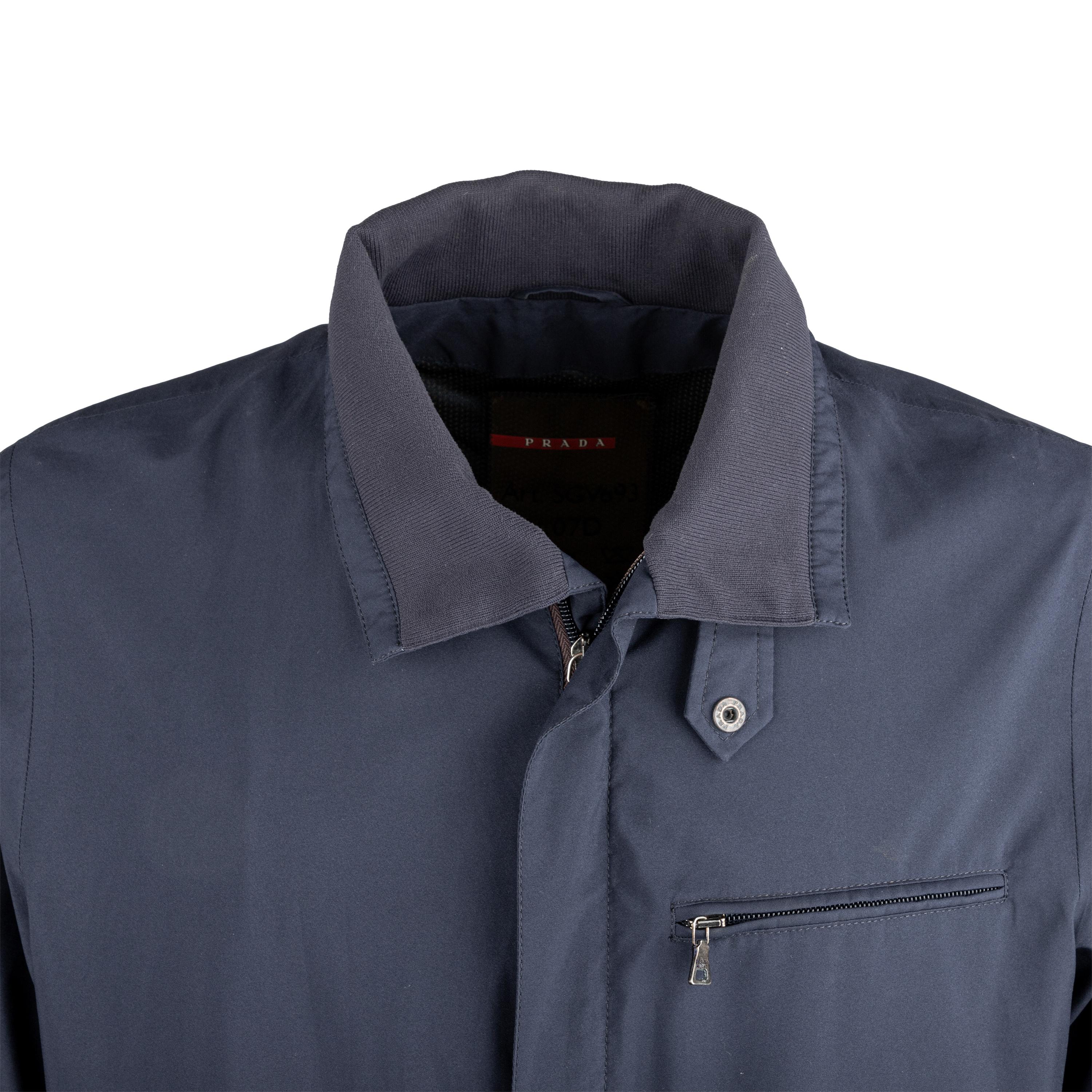 Designed for durability and style, the Prada Goretex Windbreaker Jacket is crafted from high-quality polyester with Goretex technology. Its dark blue color and hidden zipper closure offer a sleek look, while the brand accent on the hardware and