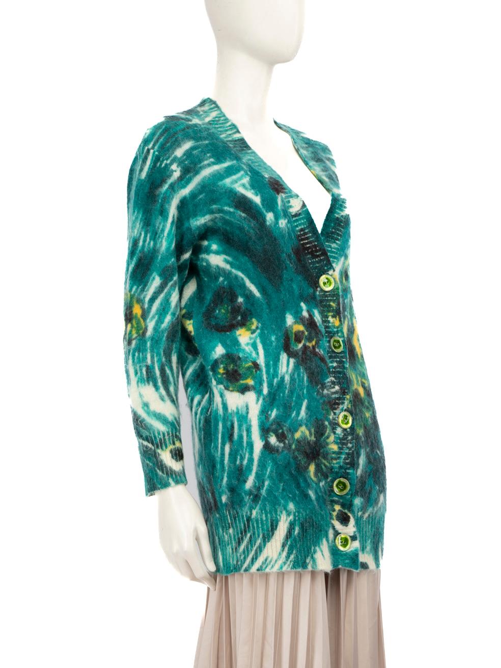 CONDITION is Very good. Hardly any visible wear to the cardigan is evident on this used Prada designer resale item.
 
 
 
 Details
 
 
 Green
 
 Mohair
 
 Knit cardigan
 
 Abstract pattern
 
 Stretchy
 
 Long sleeves
 
 V-neck
 
 Button up