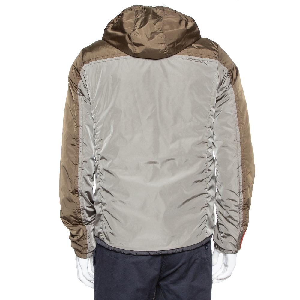 This Prada creation is reversible so it gives you the option of not just one but two jackets. It is made from quality fabrics in two colors, and it has a front zipper and two pockets. This casual jacket is a wardrobe staple you must possess.

