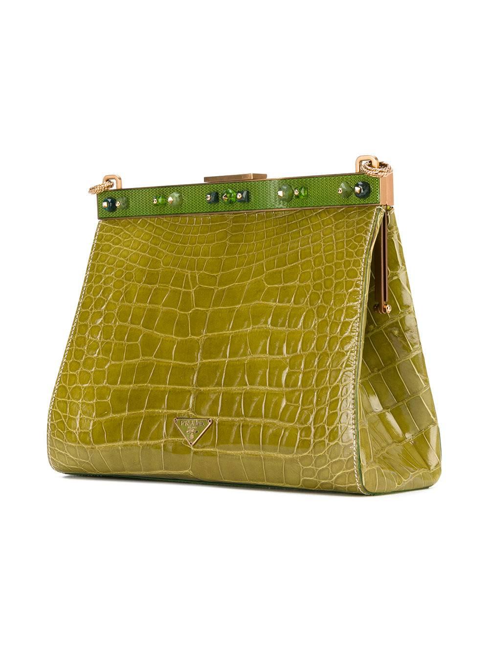 Marvelous acid green crocodile leather chain clutch by Prada. It features a chain strap, a top magnetic closure, gemstone embellishments and an internal zipped pocket. The item is vintage, it was produced in the 2000s and is in excellent conditions,