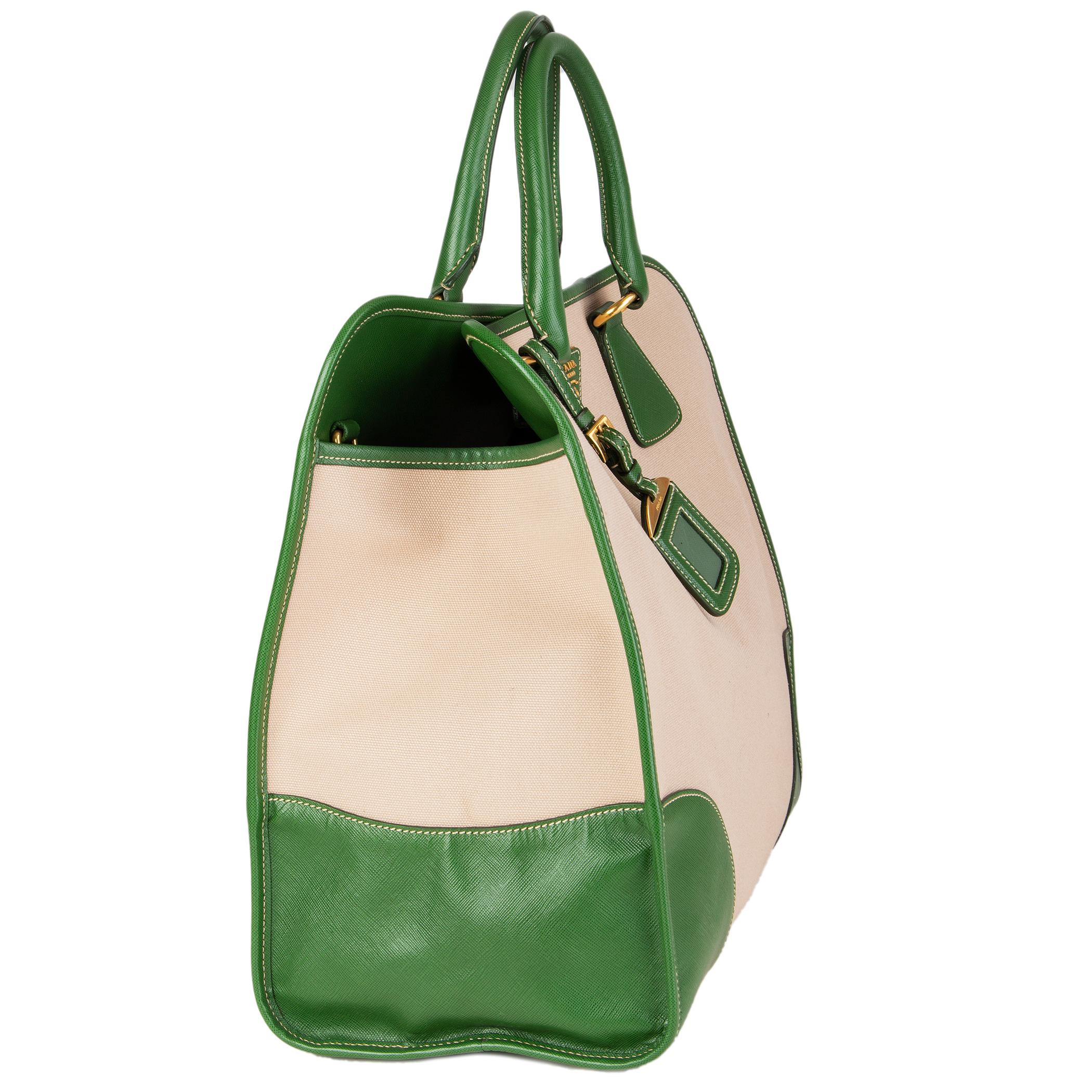 Prada framed 'North-To-South Tote Bag' in beige hemp canvas and green Saffiano calf leather details. Opens with a snap button on top. Lined in green classic Prada nylon lining with one zipper pocket against the back and front with two attached open