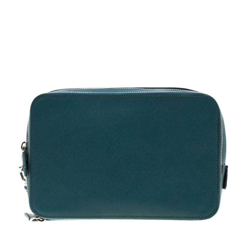 Designed in green leather, featuring a wristlet and the brand's signature at the front, this multi-functionality organizer from Prada is chic and stylish. The zip around closure opens to a leather-lined interior which is equipped with multiple card