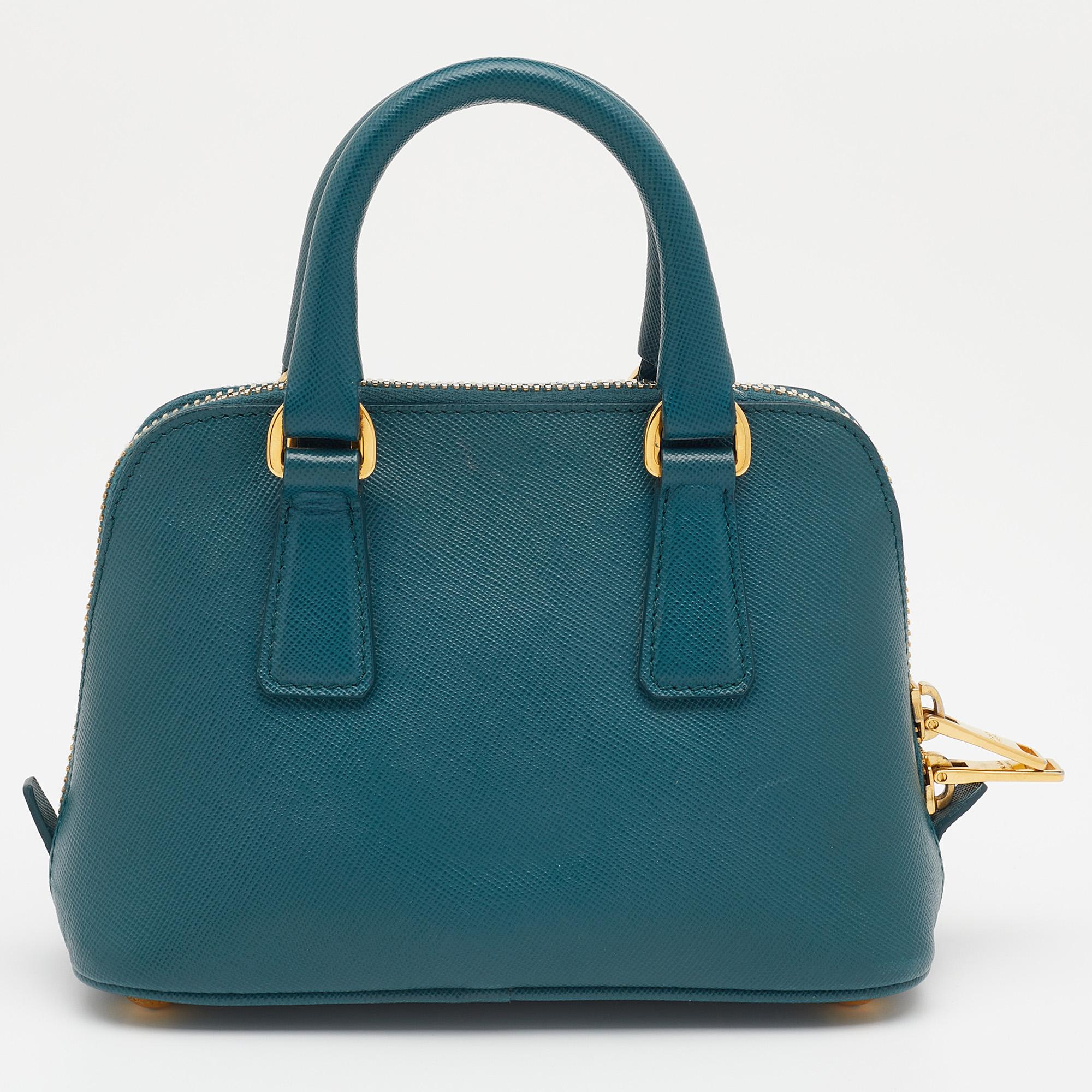 Prada's Promenade is a much-loved accessory. Lovely in green, the Saffiano leather bag features two handles, an optional strap, metal feet, and the brand logo on the front. For those who love minimally luxe pieces, this Prada bag is