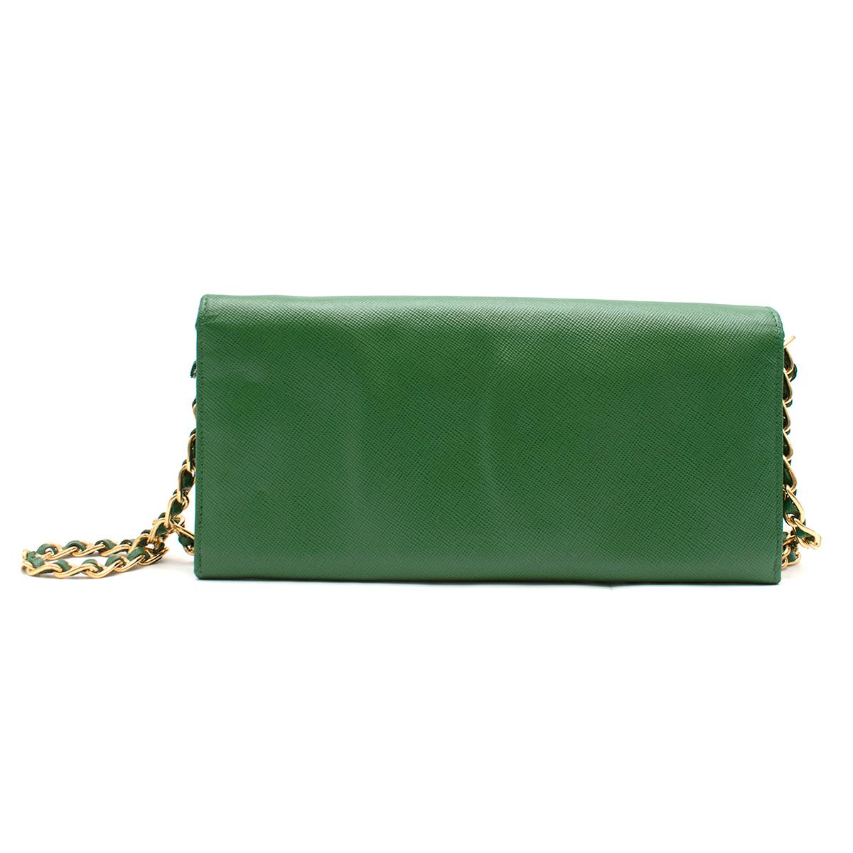Prada Green Saffiano Leather Wallet on Chain

-Green, leather 
-Gold chain hardware 
-Removable chain
-Flap opening 
-Push button closure
-Two main compartments with center zip compartment 
-Multiple open pockets for storage

Please note, these