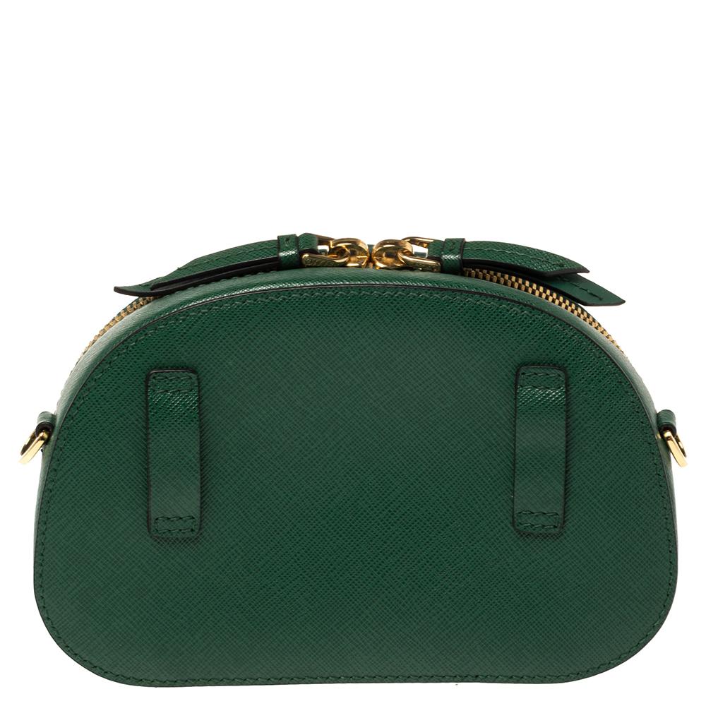 The excellently crafted handbag by Prada will make you stand apart from the crowd. Crafted from Saffiano Lux leather in a green hue, it has a sturdy silhouette. What makes this bag investment-worthy is that it can be used both as a sling bag and