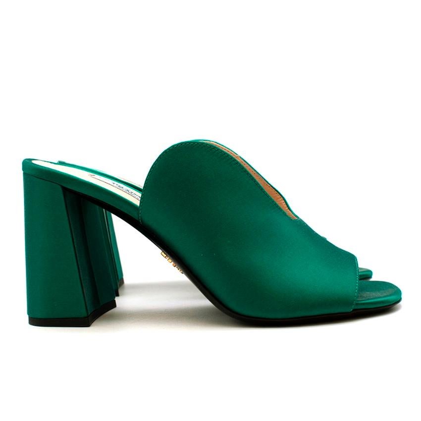 Prada Green Silk Satin Mango Mules 

-Super smooth silk satin 
-Luxurious soft leather lining 
-Gorgeous cleavage like shape 
-Beautiful emerald green shade 
-Chunky heels for stability 
-Prada branded golden hardware to the soles 

Materials:
Main-