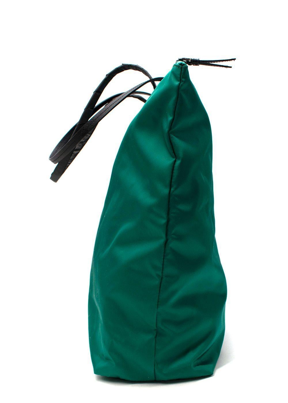 Green Tessuto Nylon Tote Bag

- Green nylon tote bag
- Top zip closure
- One compartment with a zipped pockets
- Two black leather top handles
- Signature triangle hardware Prada applique to the front

Materials:
Leather
Nylon

Made in Italy

PLEASE