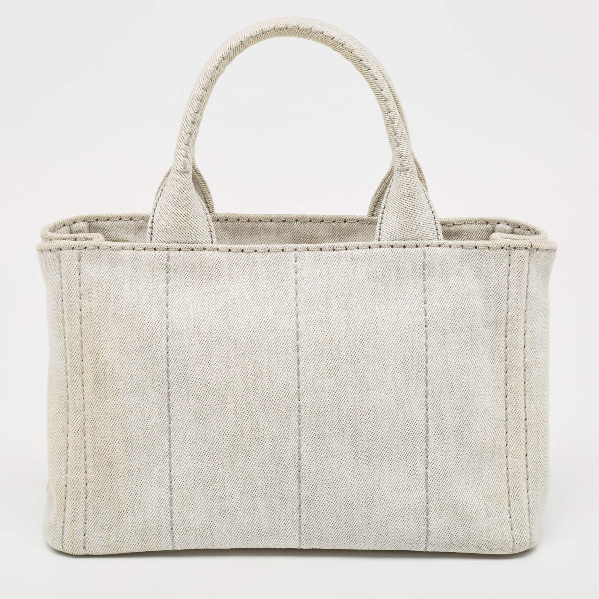 A creation that is both highly functional and appealing is this tote by Prada. Crafted from denim, this tote is held by dual handles and equipped with a spacious interior to hold your essentials with ease.

Includes: Authenticity Card, Info Booklet,