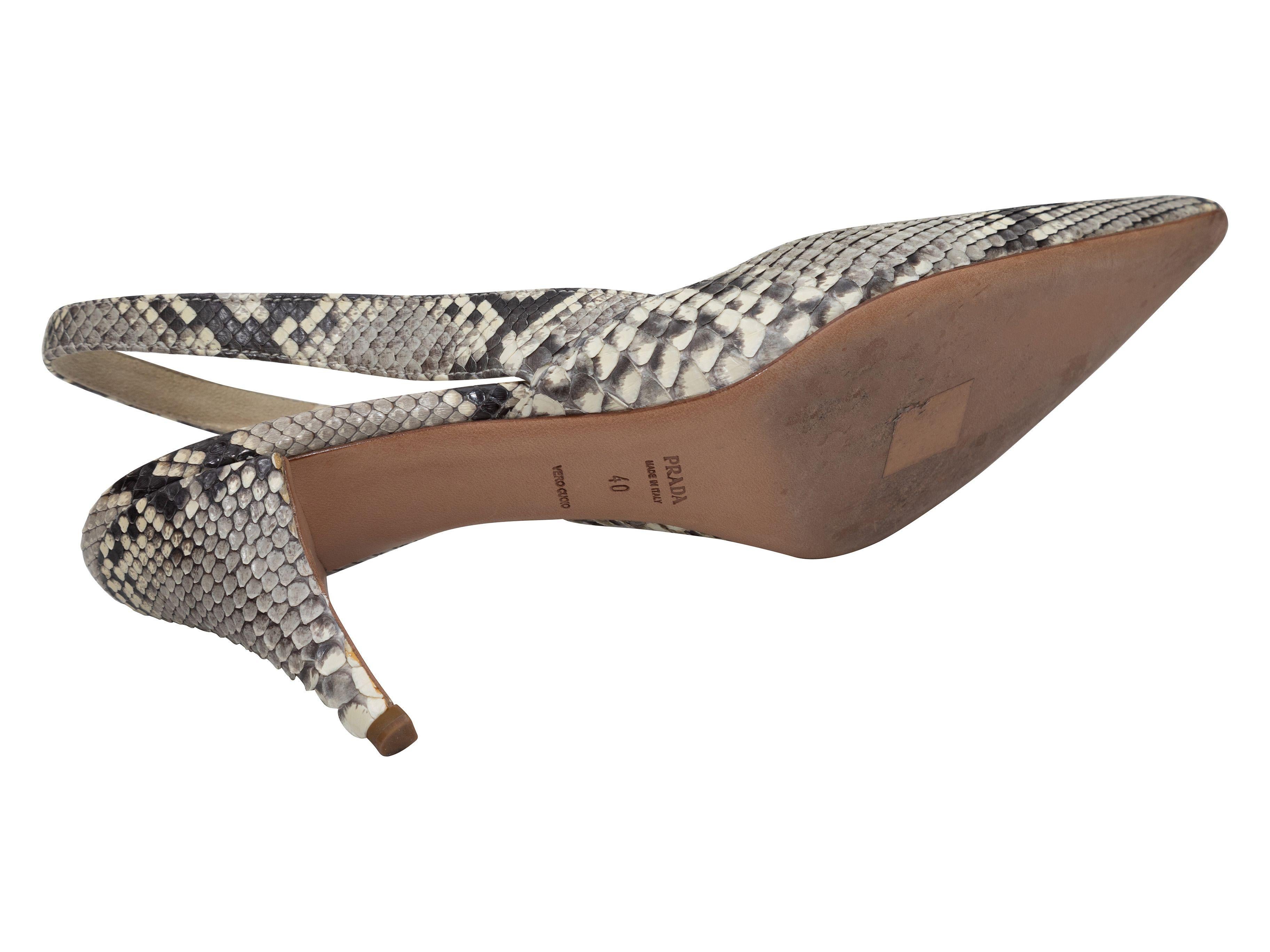Product Details: Grey and black python slingback pumps by Prada. Pointed toes. 3.5