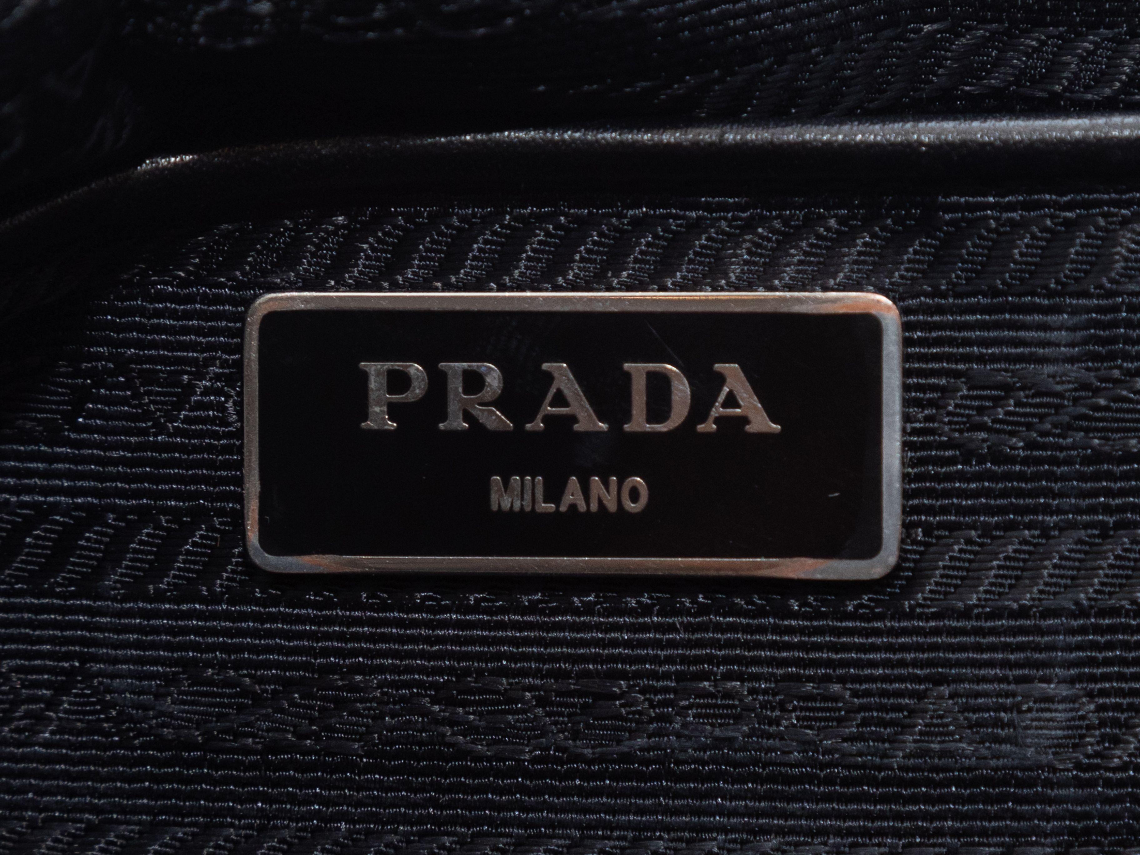 Product Details: Grey & Black Prada Stampato Alabastro Print Tote Bag. The Stampato Alabastro tote bag features a nylon body, leather trim throughout, silver-tone hardware, dual rolled top handles, a single shoulder strap, and a top zip closure. 16