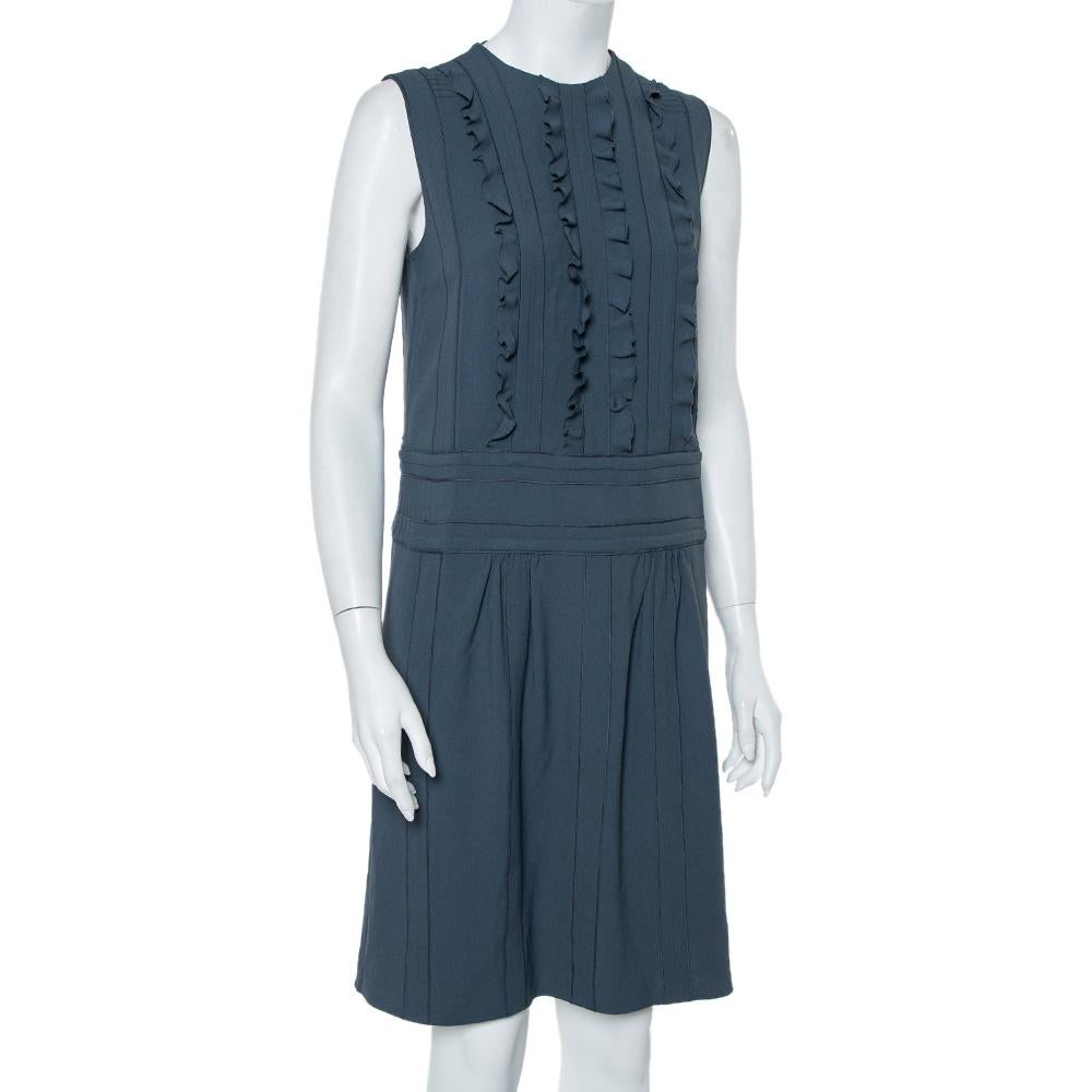 Prada's unique aesthetics and craftsmanship come alive in this stunning dress. Made from a blend of quality materials, the dress features ruffle details on the bodice area and a pleated design on the skirt. Style the creation with high heels and a