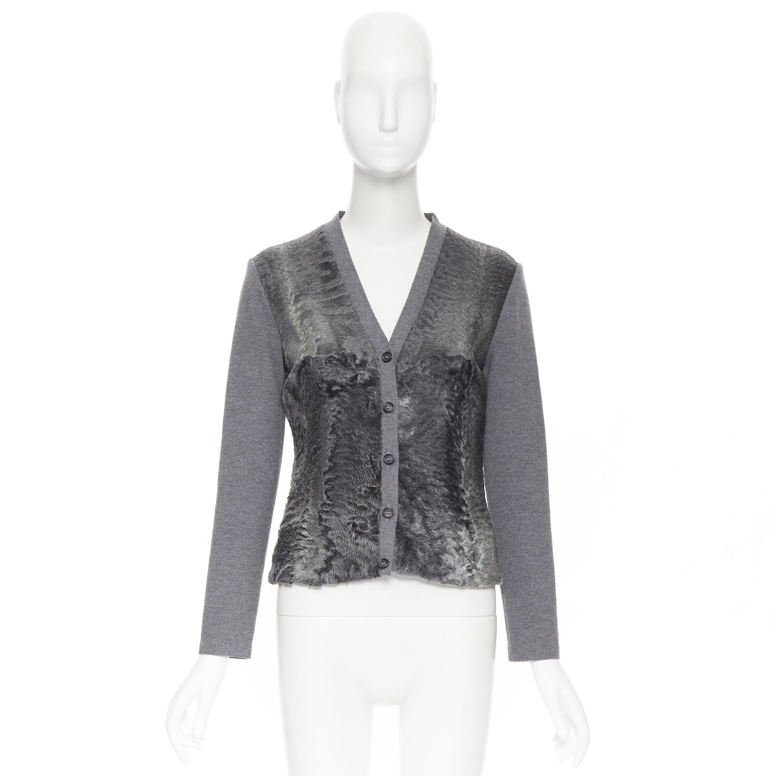 PRADA grey dyed breitschwanz fur front lamb wool knitted cardigan jacket IT42 
Reference: CC/GEHI00316 
Brand: Prada 
Designer: Miuccia Prada 
Material: Wool 
Color: Grey 
Pattern: Solid 
Closure: Button 
Made in: Italy 

CONDITION: 
Condition: