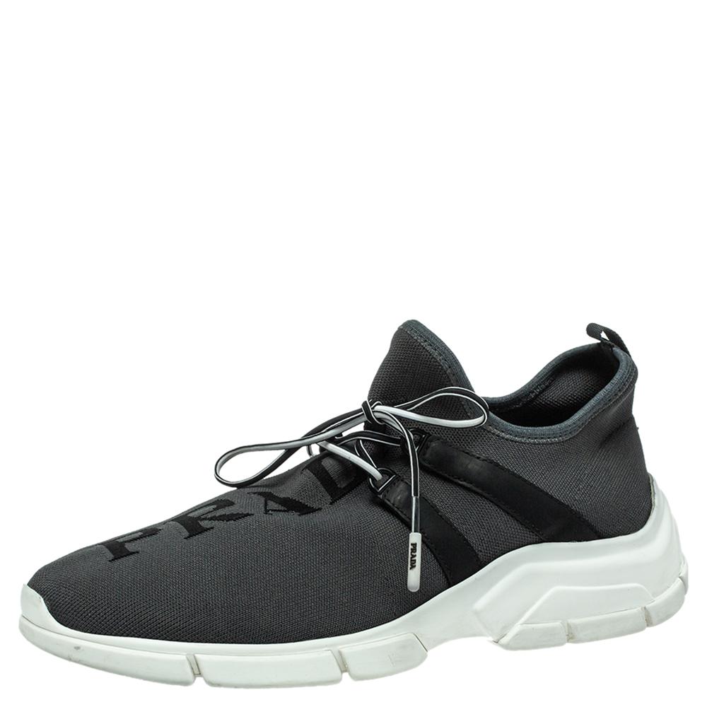 These sneakers are perfectly crafted from supreme quality knit fabric. Designed by Prada, they are a fine blend of comfort and style. The pair features a simple shade of grey, lace-up vamps, and rubber soles for added ease.

Includes: Info Booklet,