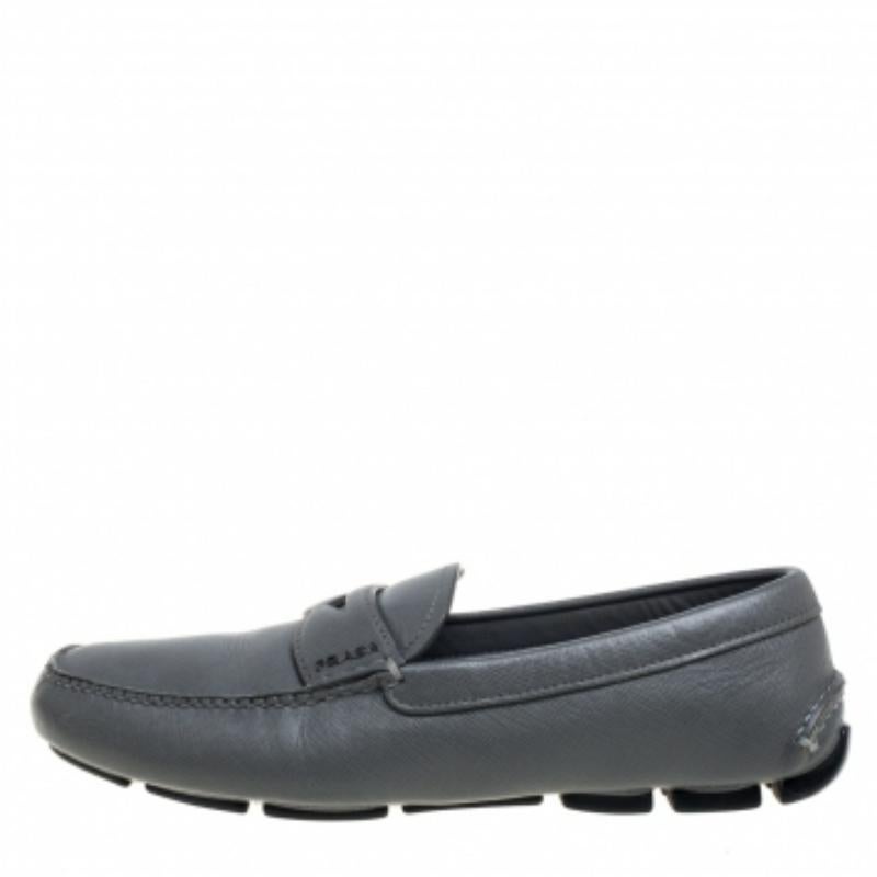Stylish and super comfortable, this pair of loafers by Prada will make a great addition to your shoe collection. They have been crafted from quality leather and styled with silver-tone logo detailing on the vamps. Leather insoles and rubber outsoles