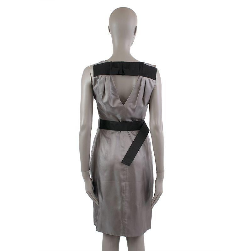 Prada belted sleeveless dress in grey silk (100%). Opens with a zipper on the back. Has been worn and is in excellent condition.

Tag Size 40
Size S
Shoulder Width 47cm (18.3in)
Bust To 92cm (35.9in)
Waist To 68cm (26.5in)
Hips To 98cm