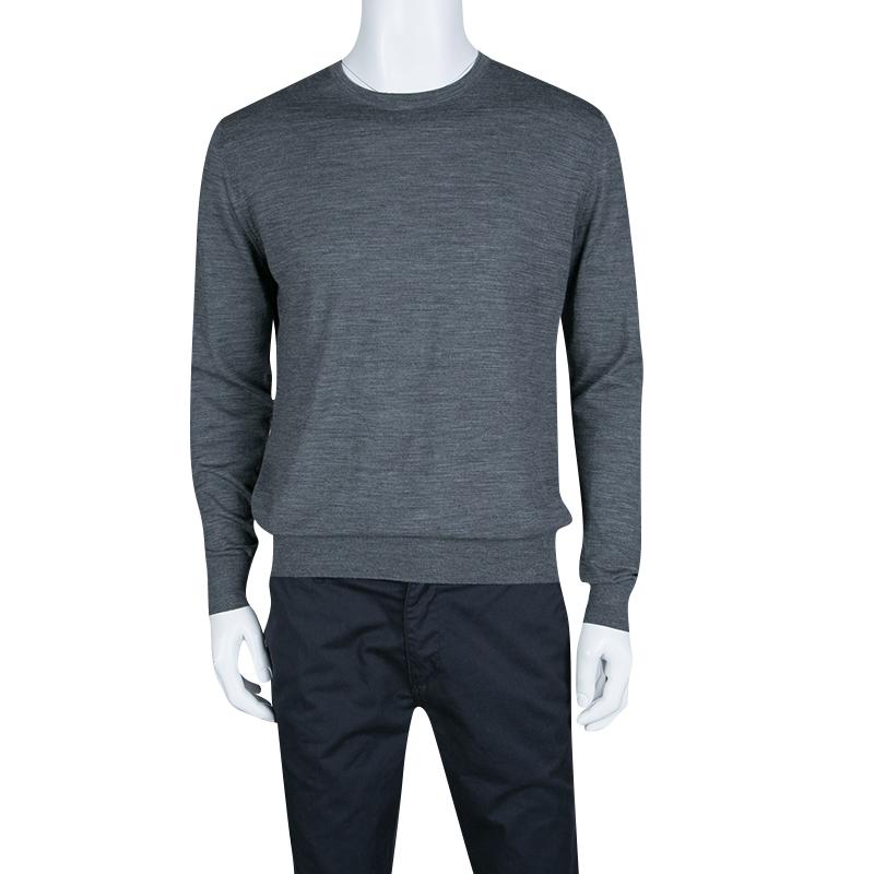 The understated grey hue and slub knitting combine to make this Prada sweater a snug style that can be flaunted with a lot of variety. It is crafted with a wool blend and features a crew neck and long cuffed sleeves. Sport this with your regular