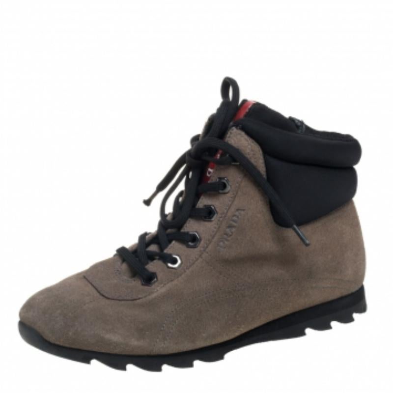 Elevate your style quotient with these Prada sneakers. Crafted from the finest suede and fabric, these shoes are just what you need this season. These grey high-top sneakers would look best when teamed with a casual tee and a pair of denim.