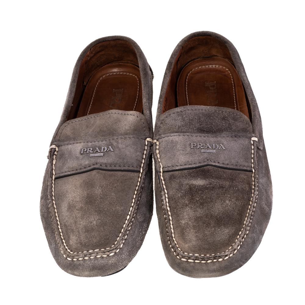 Stylish and super comfortable, this pair of loafers by Prada will make a great addition to your shoe collection. They have been crafted from quality suede and styled with logo detailing in silver-tone on the vamps. Leather insoles and rubber