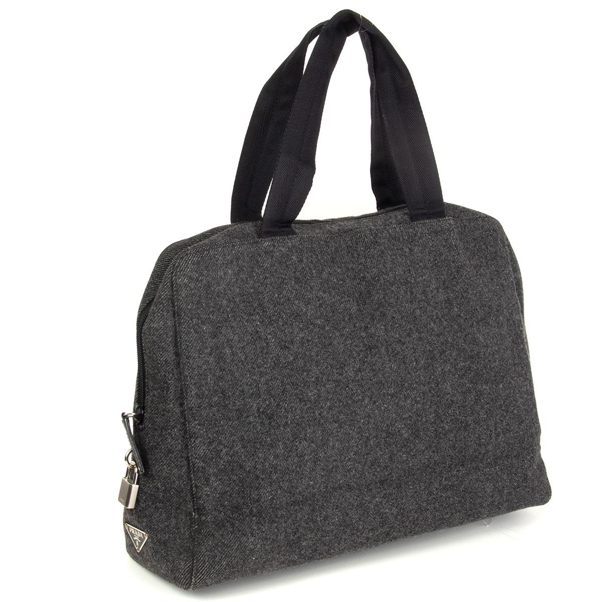 Prada double handle bag in grey wool with black nylon handles. Lined in black nylon with one open pocket against the back. Has been carried with some wear to the edges. Overall in very good condition. Comes with dust bag.

Height 28cm (10.9in)
Width