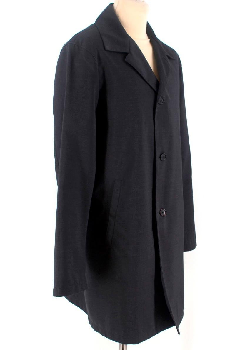 Prada Grey Wool Overcoat

- Mens overcoat
- Charcoal grey 
- Virgin wool
- Wood effect button fastening
- Long sleeves
- Side pockets
- Two internal buttoned pockets
- Rear vent

Please note, these items are pre-owned and may show some signs of