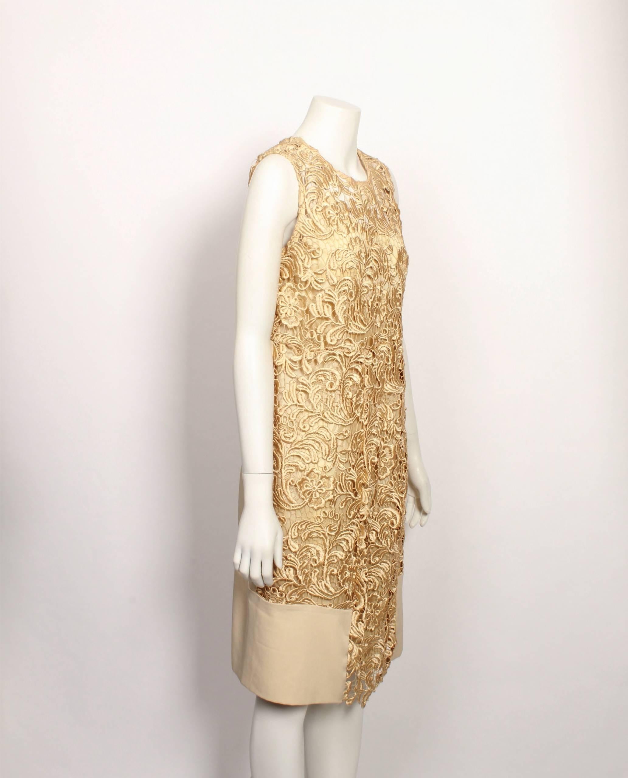 Classic Prada pale gold guipure lace sleeveless shell dress with slip lining and sheer décolletage and back shoulders. Solid fabric panels at front hemline and side back panels. Side zipper fastening. There is some discolouration around the