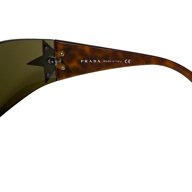 Prada Gun Metal Star Silver/Brown Unisex Shield Sunglasses (SPR 72G) at  1stDibs | prada star sunglasses, prada star shield sunglasses, prada  sunglasses star