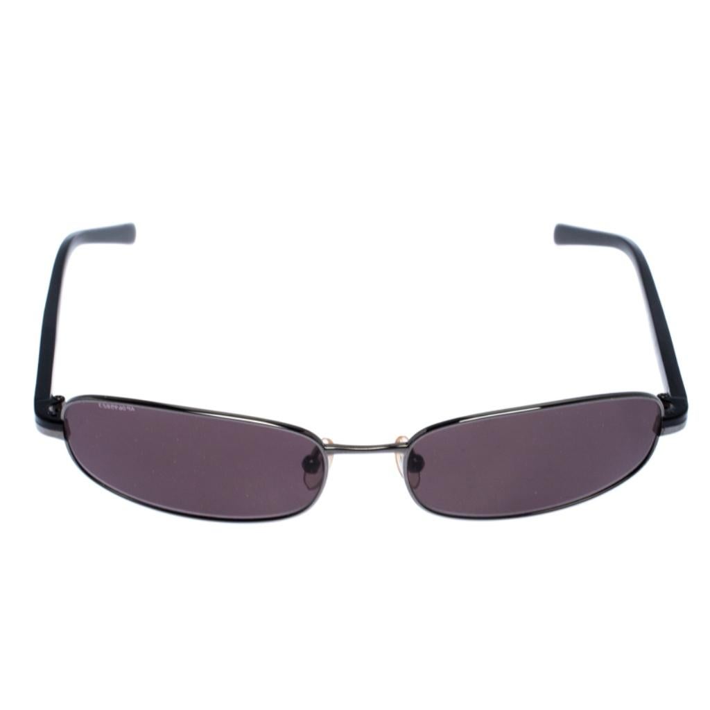 The stylish frame sculpted in acetate and gunmetal-tone metal into a rectangular shape, makes these sunglasses a high-fashion accessory that you must own. From the house of Prada, they will look best with your daytime statement outfits.

Includes:
