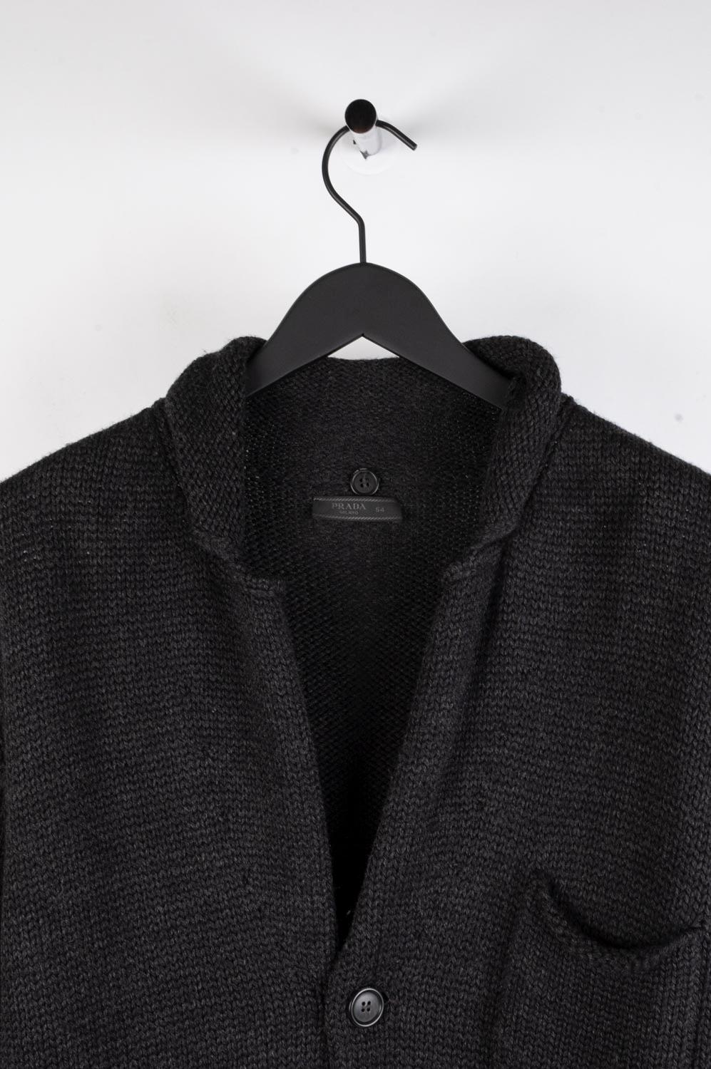 Item for sale is 100% genuine Prada Cardigan Men Sweater, S513
Color: Dark Grey
(An actual color may a bit vary due to individual computer screen interpretation)
Material: No care tag. Seems wool
Tag size: ITA54 (runs Large) 
This sweater is great