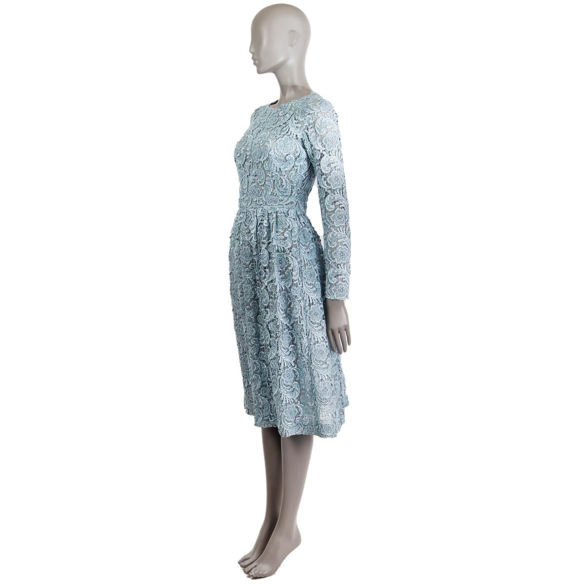 Prada long sleeve empire waist embroidered dress in ice blue viscose (60%), metal (30%) and polyester (10%) with a round neck. Closes on the back with a zipper. Lined and dress is semi-sheer. Has been worn and is in excellent condition. 

Tag Size