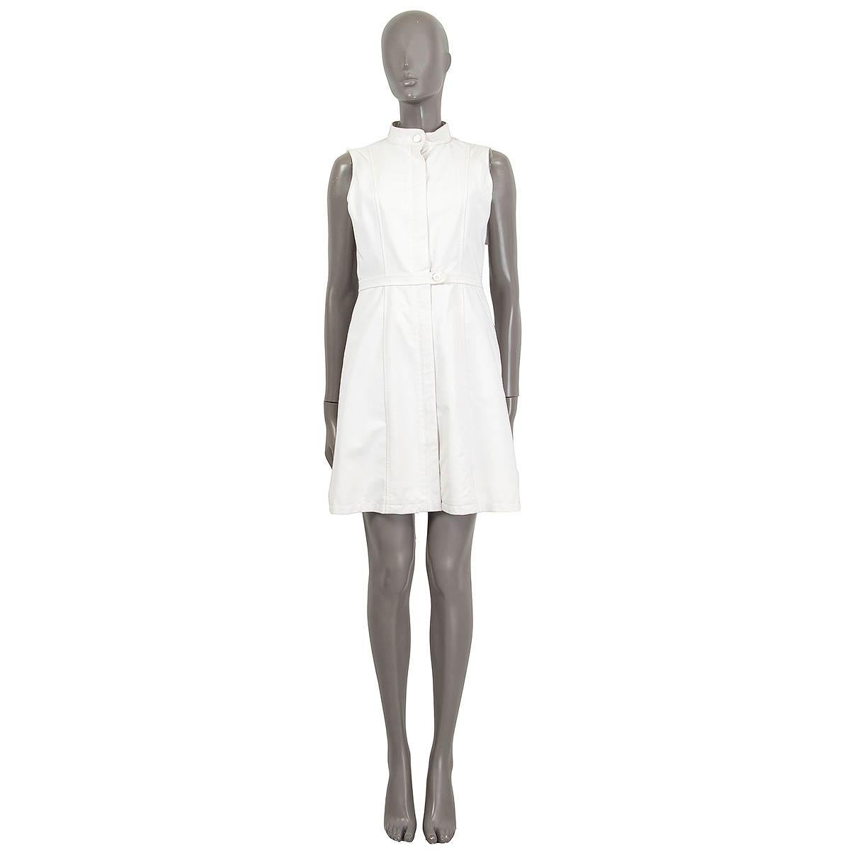 100% authentic Prada sleeveless high neck dress in ivory nylon (95%) and rubber (5%). Opens with two buttons and a zipper on the front. Lined in ivory (96%) and spandex (4%). The button at the neck is broken otherwise in excellent