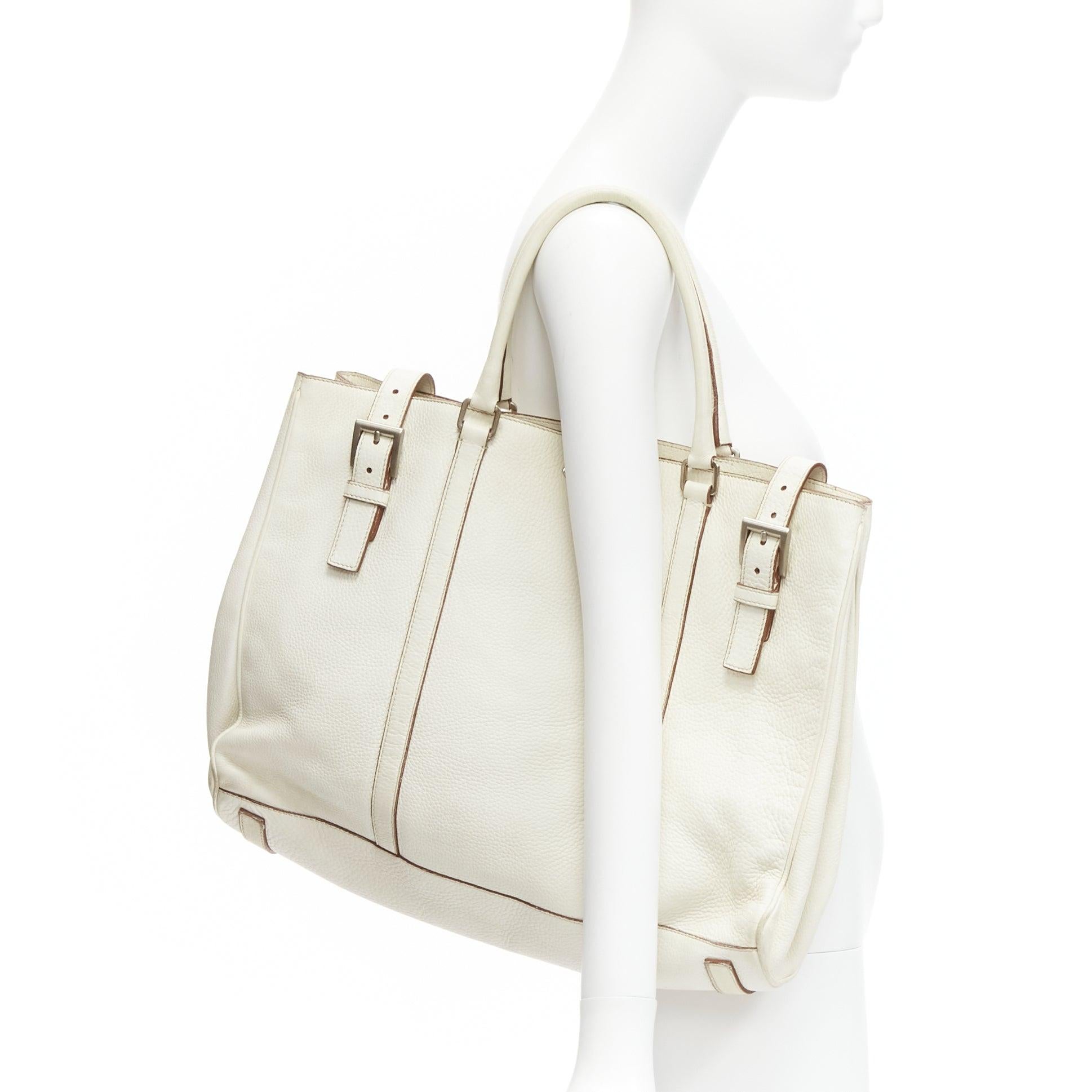 PRADA ivory white grained leather silver triangle logo buckle strap tote bag
Reference: GIYG/A00293
Brand: Prada
Designer: Miuccia Prada
Material: Leather
Color: White
Pattern: Solid
Closure: Buckle
Lining: Brown Leather
Made in: