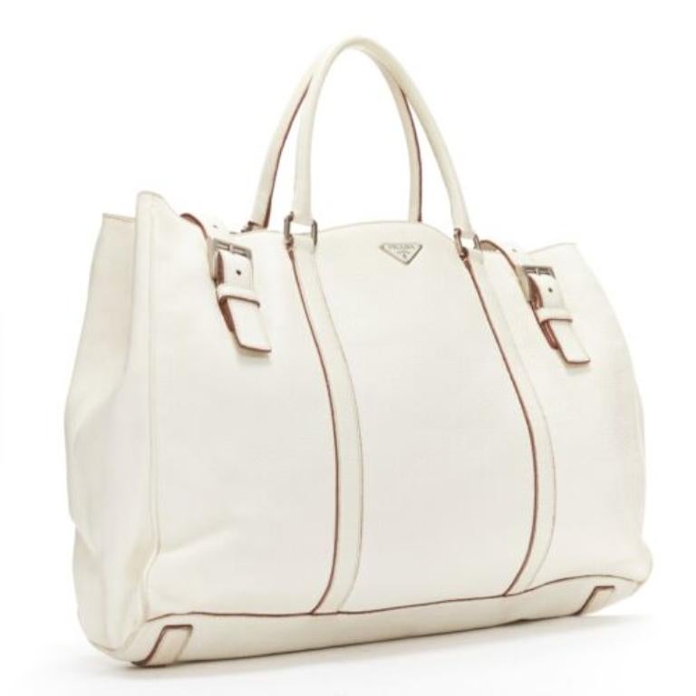 Beige PRADA ivory white grained leather silver triangle logo buckle strap tote bag For Sale