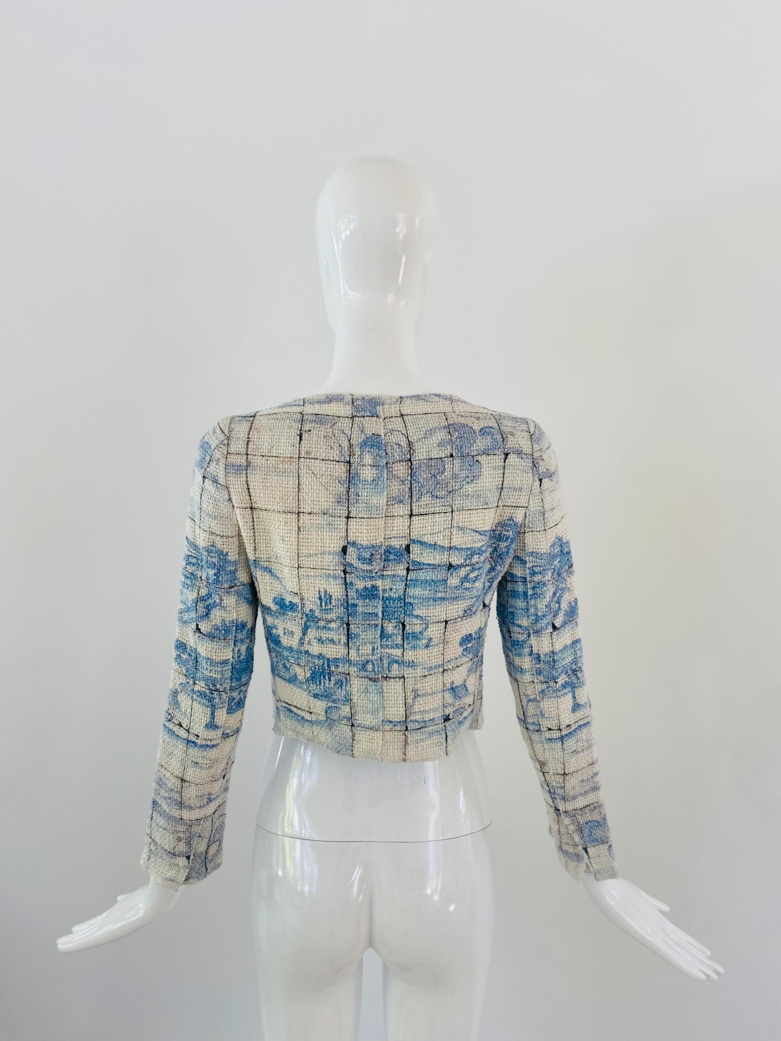 Cropped Prada jacket in white and sky blue woven cotton /linen mix with snap buttons, a boat neck and long sleeves. The print is a beautiful Chinese chinoiserie print and the inside is lined with the same print in a soft silk. Excellent condition.