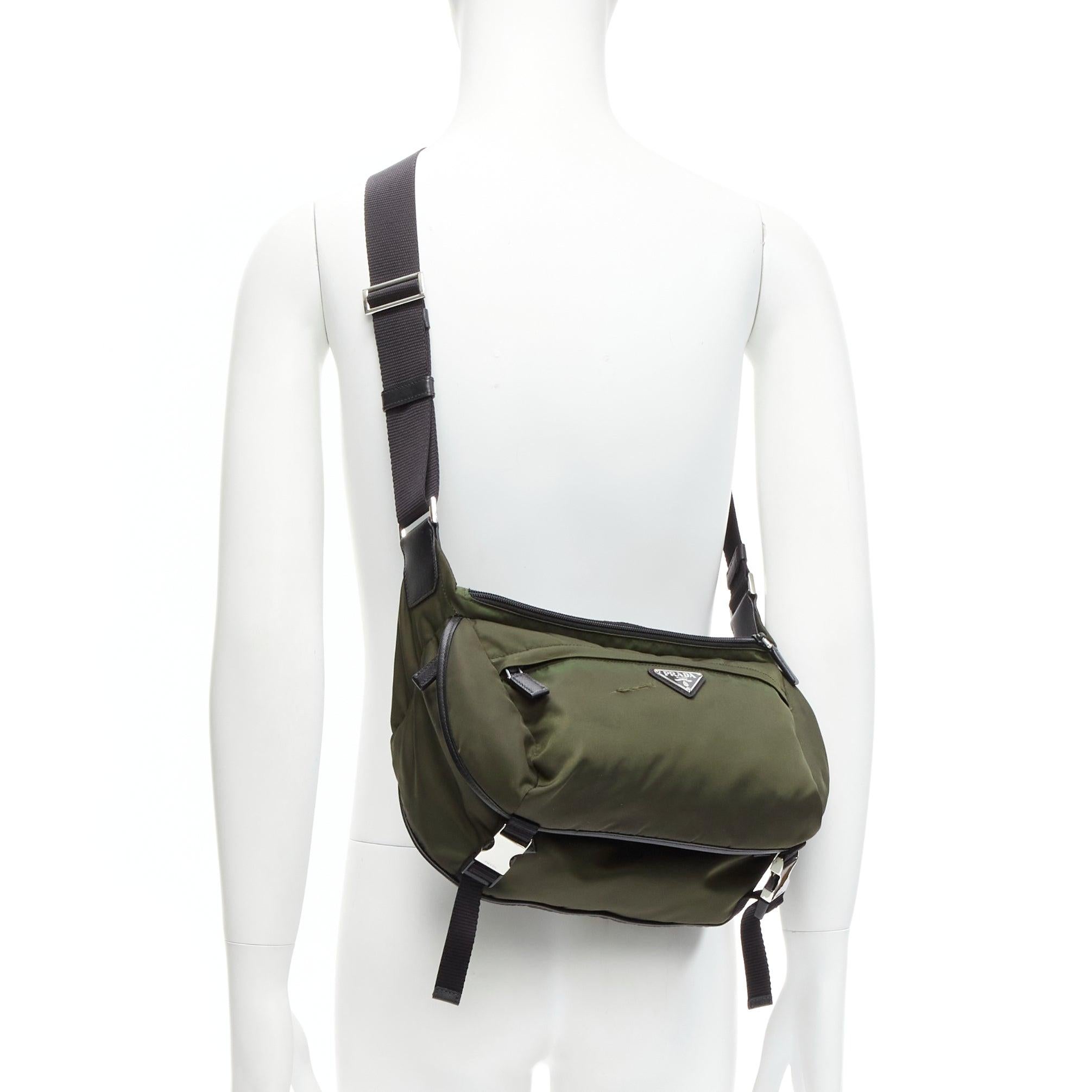 PRADA khaki green triangle logo nylon black strap crossbody bag
Reference: CNLE/A00224
Brand: Prada
Designer: Miuccia Prada
Material: Nylon
Color: Green
Pattern: Solid
Closure: Zip
Lining: Black Fabric
Made in: Italy

CONDITION:
Condition: Fair,